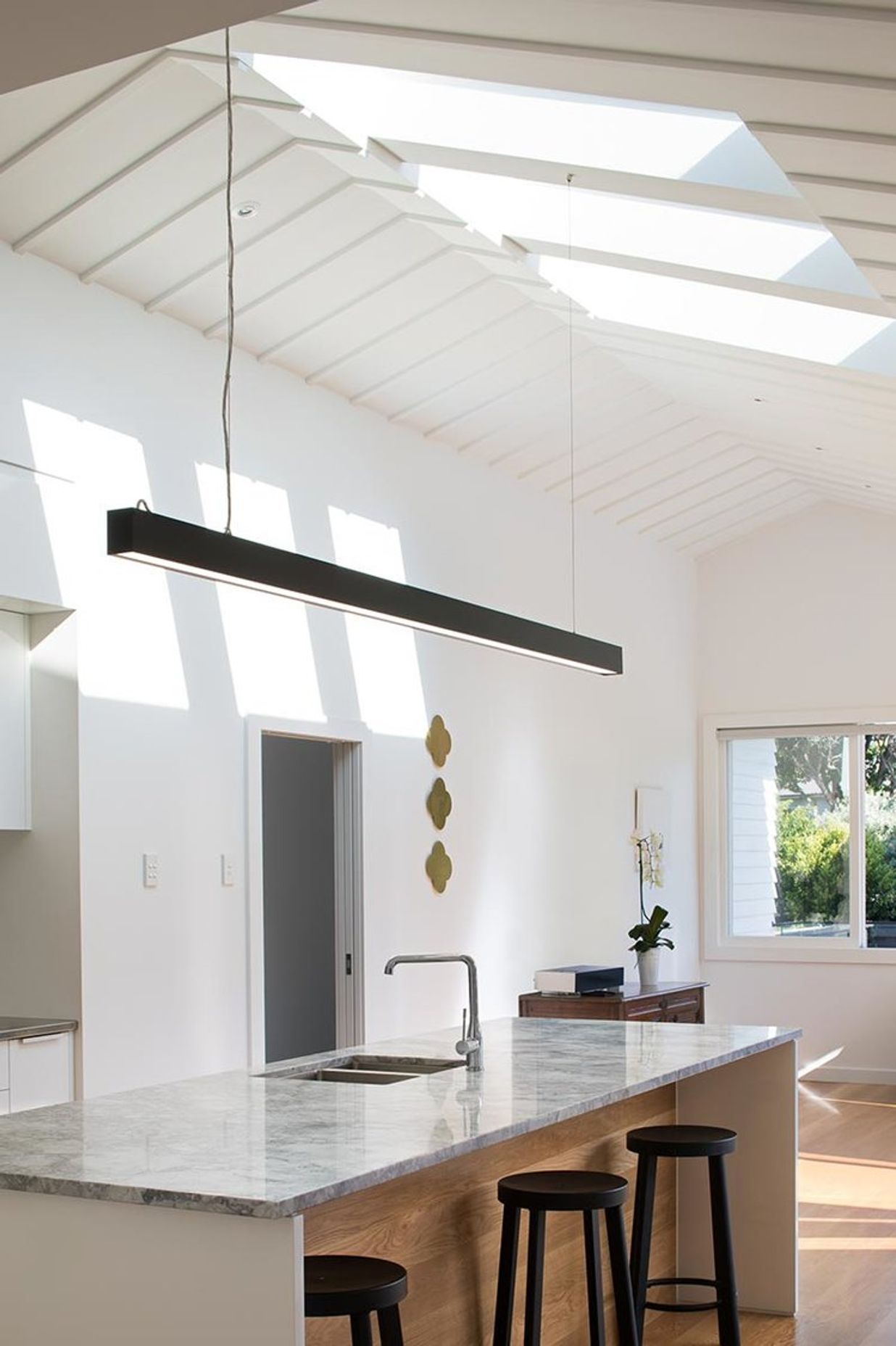 Central to the renovation was providing more light through skylights. The existing traditional profile of the roof / ceiling was preserved, and complimented by clean, bold skylights that enhanced the sense of space in the house.