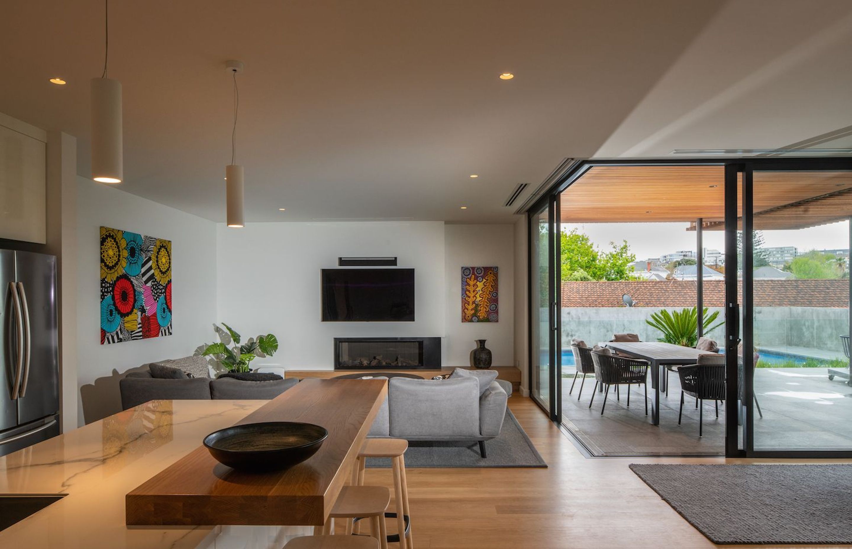 A neutral, natural palette defines the interior spaces, with Tasmanian Oak flooring throughout.