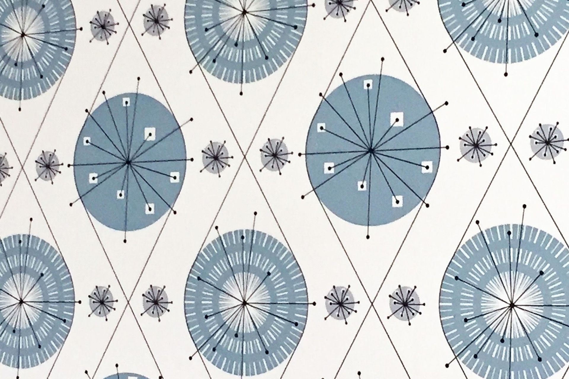 The hub and spoke pattern on this wall paper references the brace and wire fixed to teeth by orthodontists - it also inspired the ceiling light design