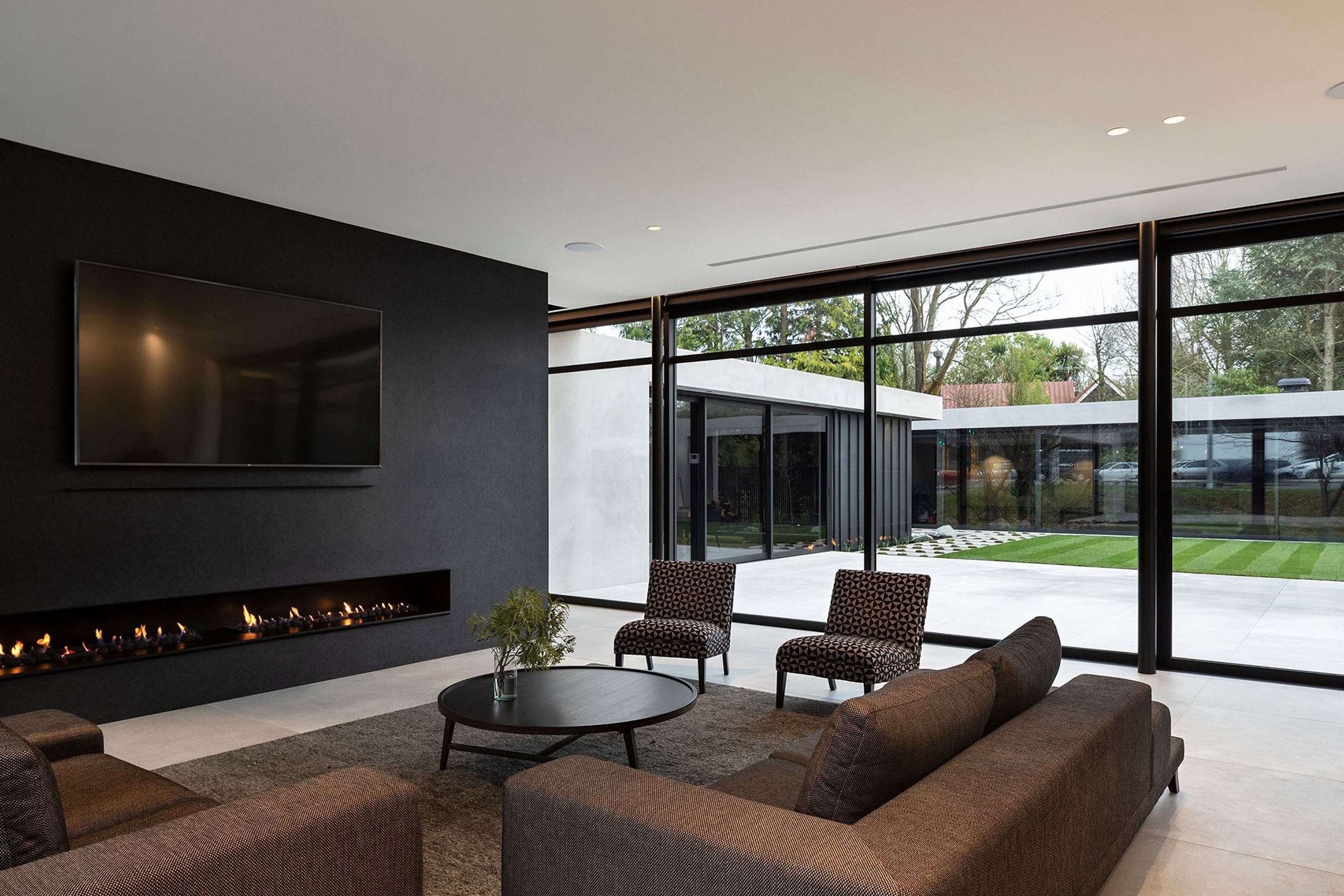 The boundary between indoors and out has been blurred through the seamless use of materials, which creates a smoothly continuous flow from the main living area to the courtyard and separate garden pavilion containing the swimming pool, spa and a change ro