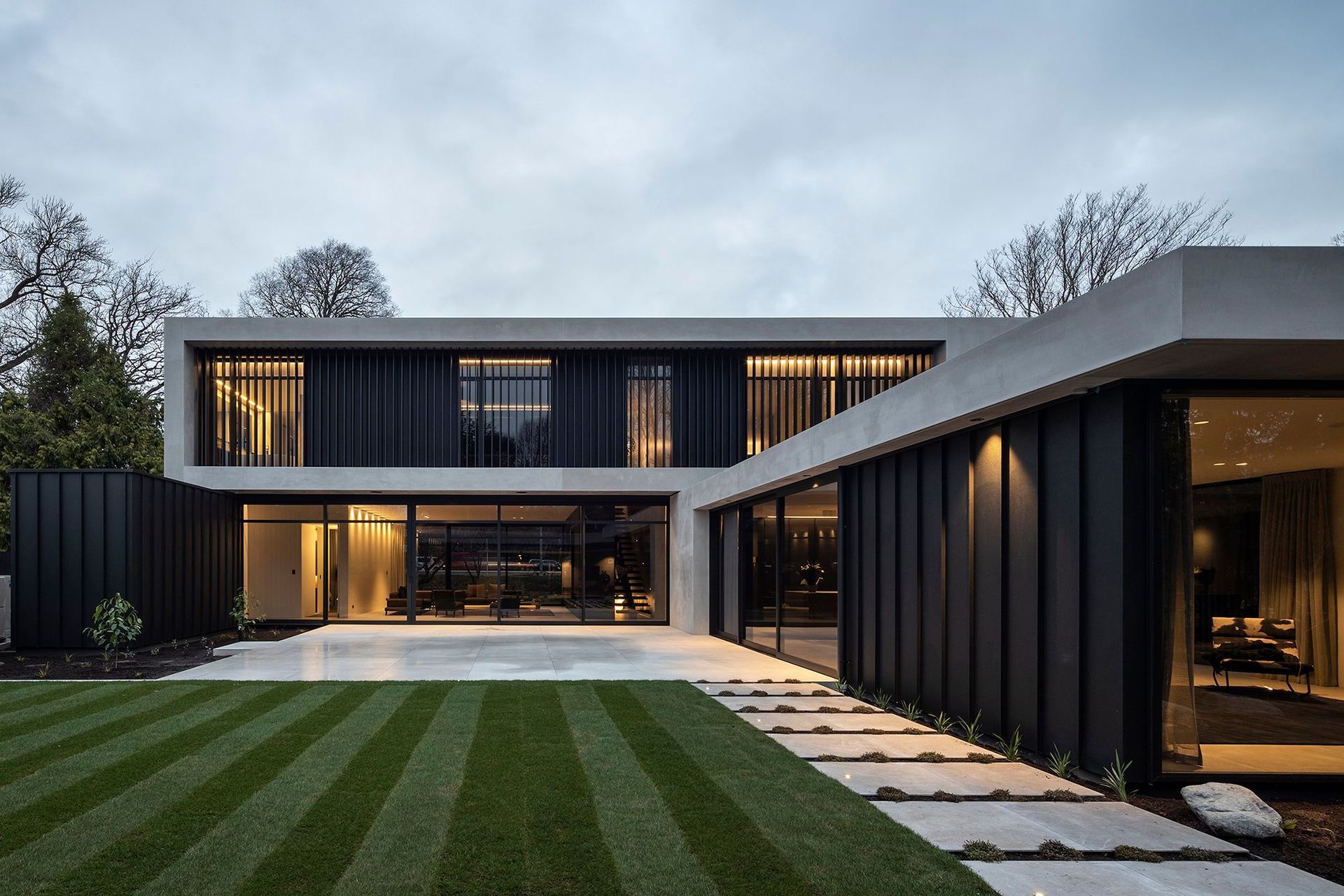 A series of interlinked, stacked forms creates a protected courtyard as well as a series of interconnected internal spaces.
