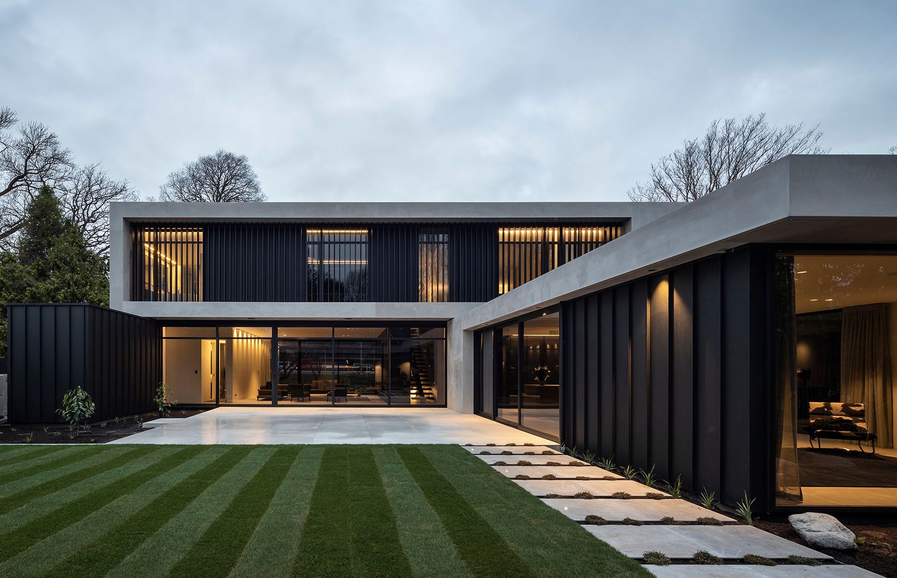 A series of interlinked, stacked forms creates a protected courtyard as well as a series of interconnected internal spaces.