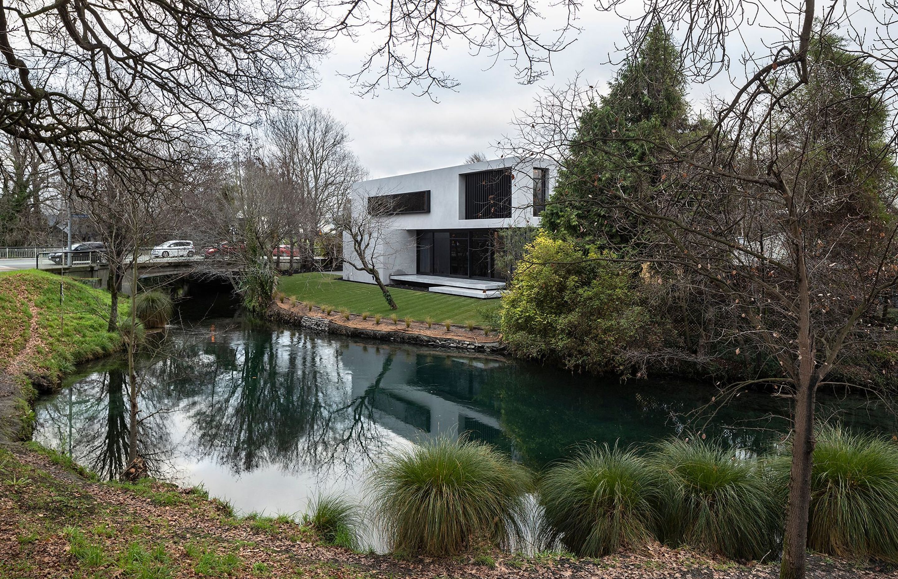 Located on a busy corner site on the fringe of Hagley Park, this house needed to embrace its riverside location while providing a high level of privacy for its owners.