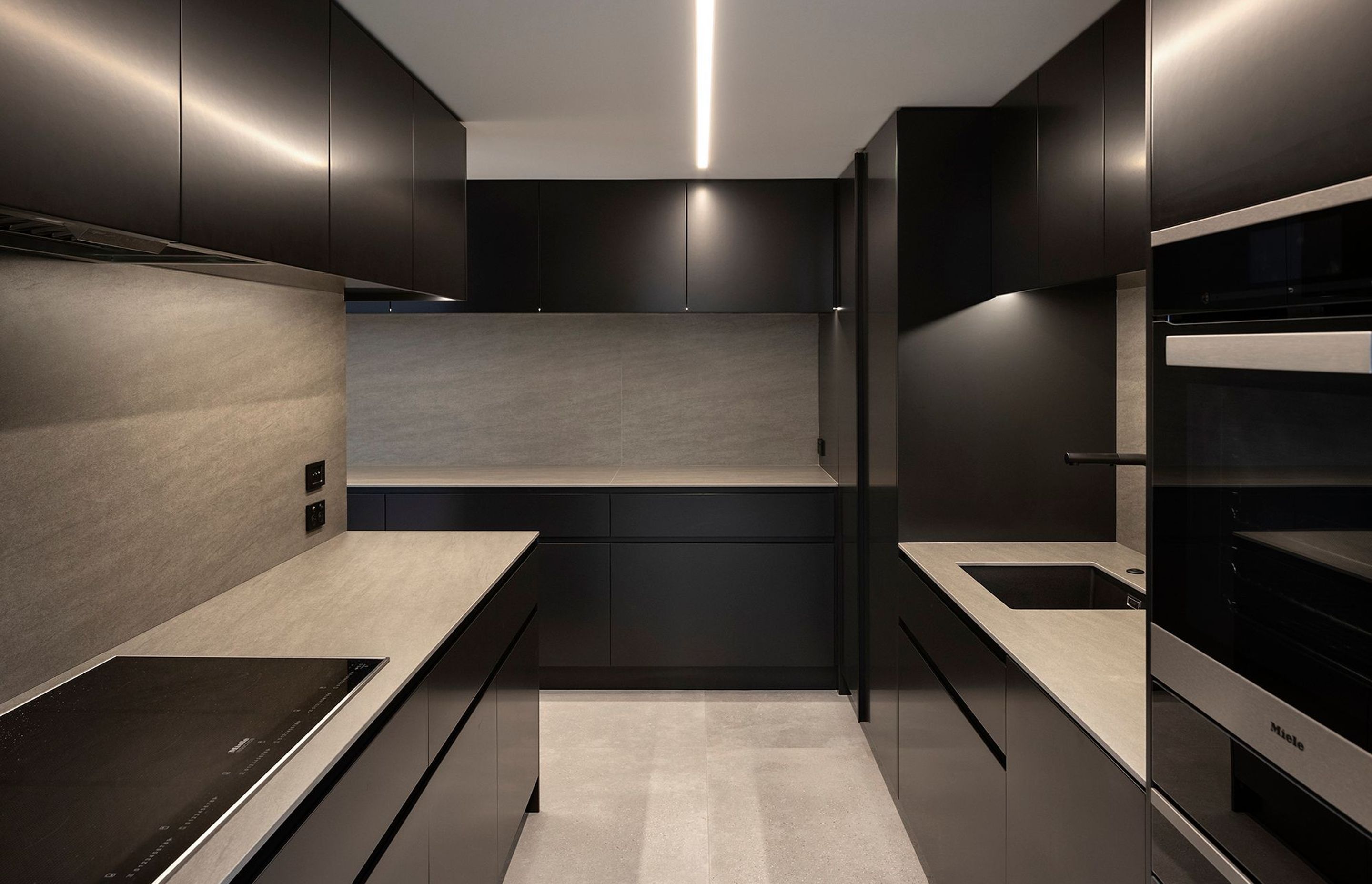 Located in a separate space, the working heart of the kitchen is removed from the living areas.
