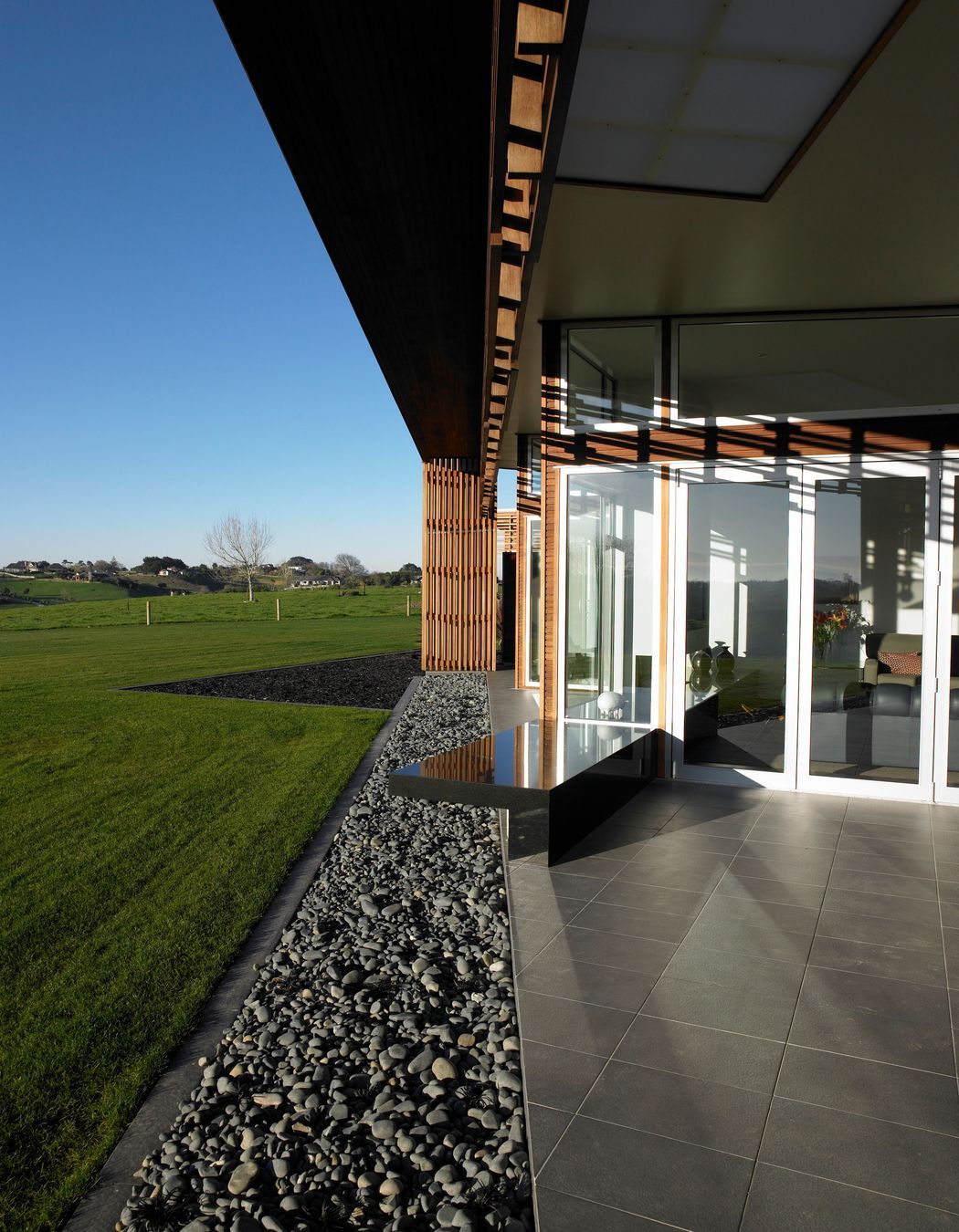 Textures galore, polished concrete along with smooth pebbles and cool tile. Tactility abounds.