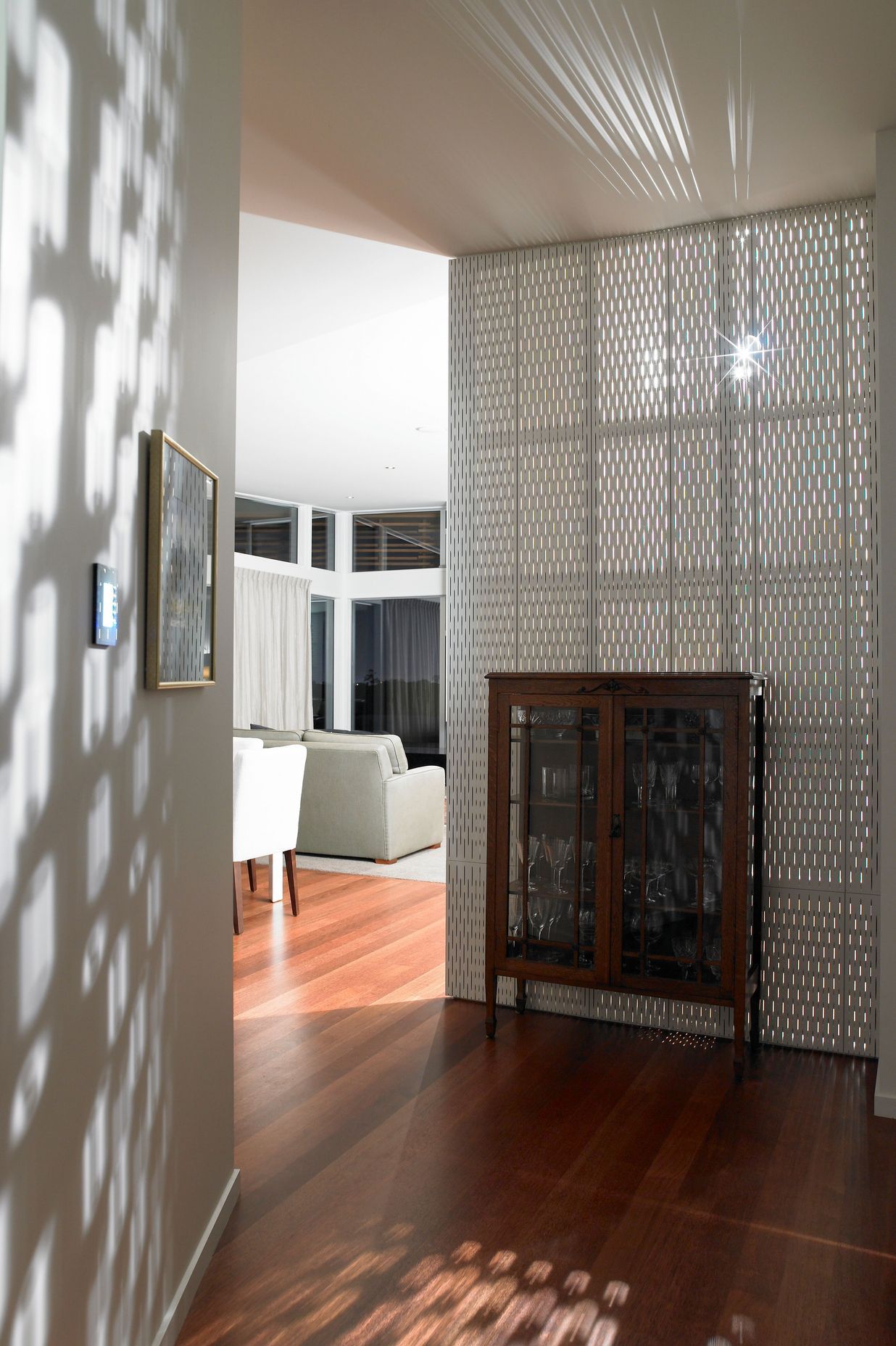 Heritage glass cabinet contrasts with the modernist textures.