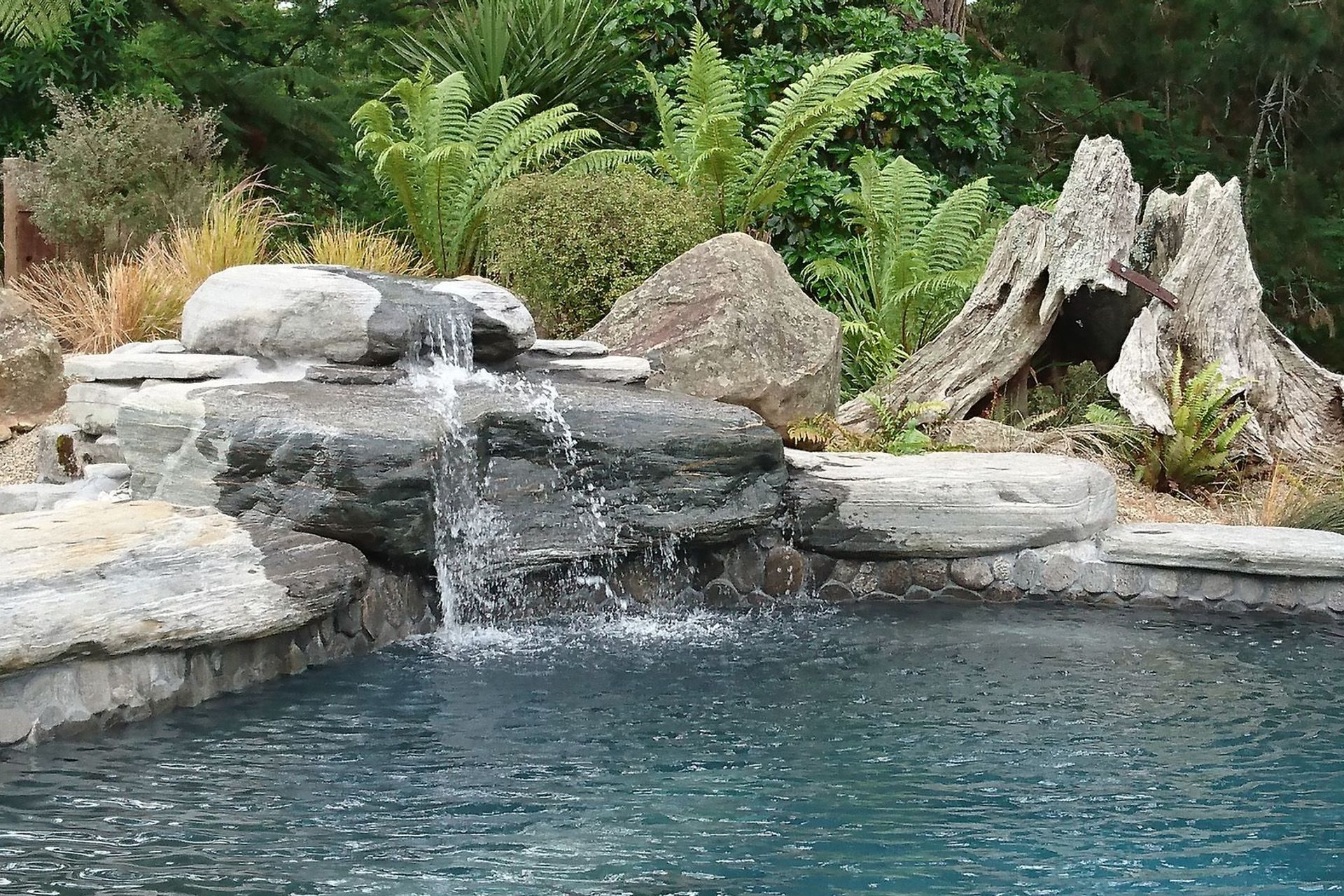 Schist water feature, enhanced by Totara stump and locally sourced Basalt feature rocks