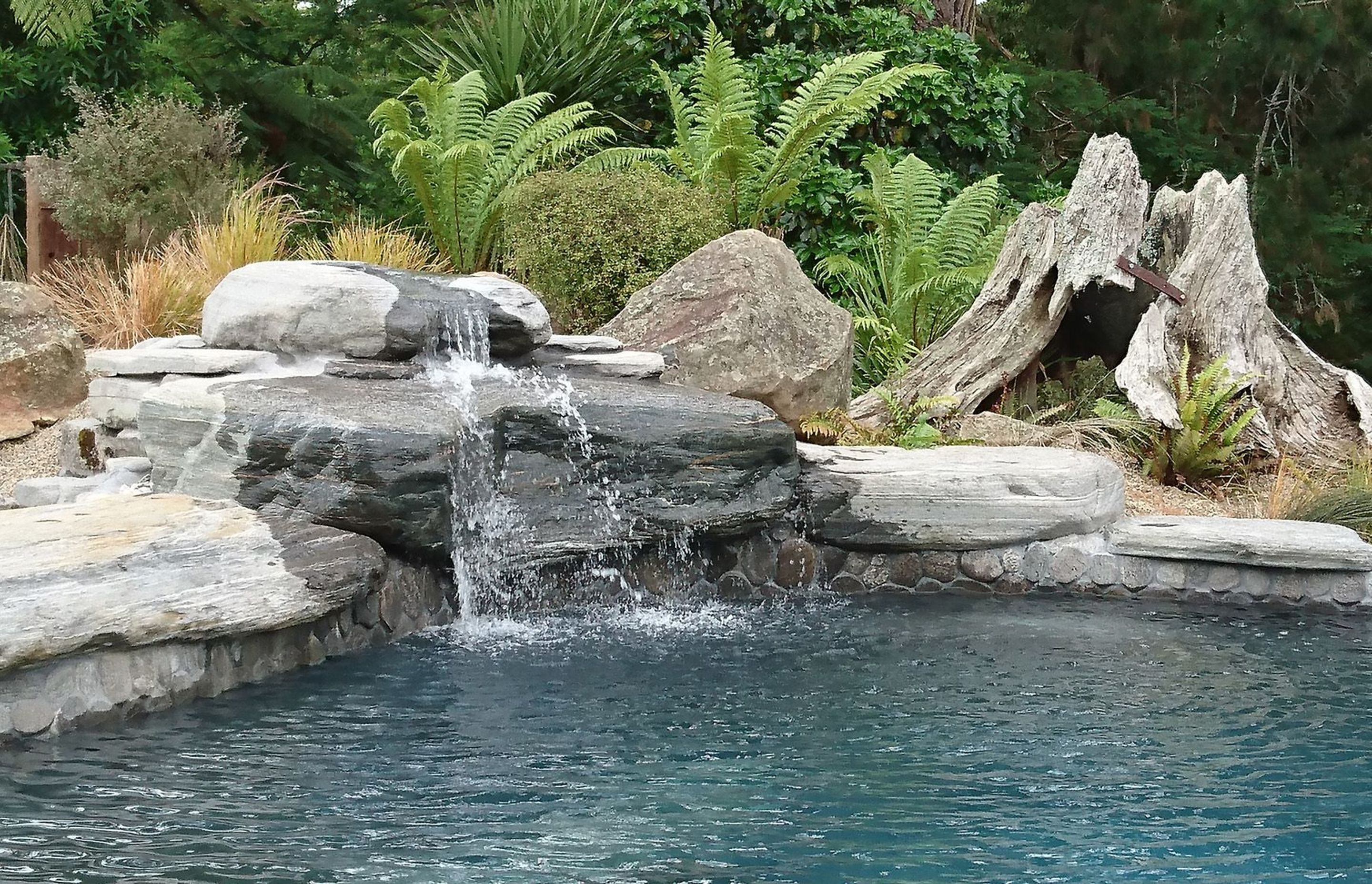 Schist water feature, enhanced by Totara stump and locally sourced Basalt feature rocks