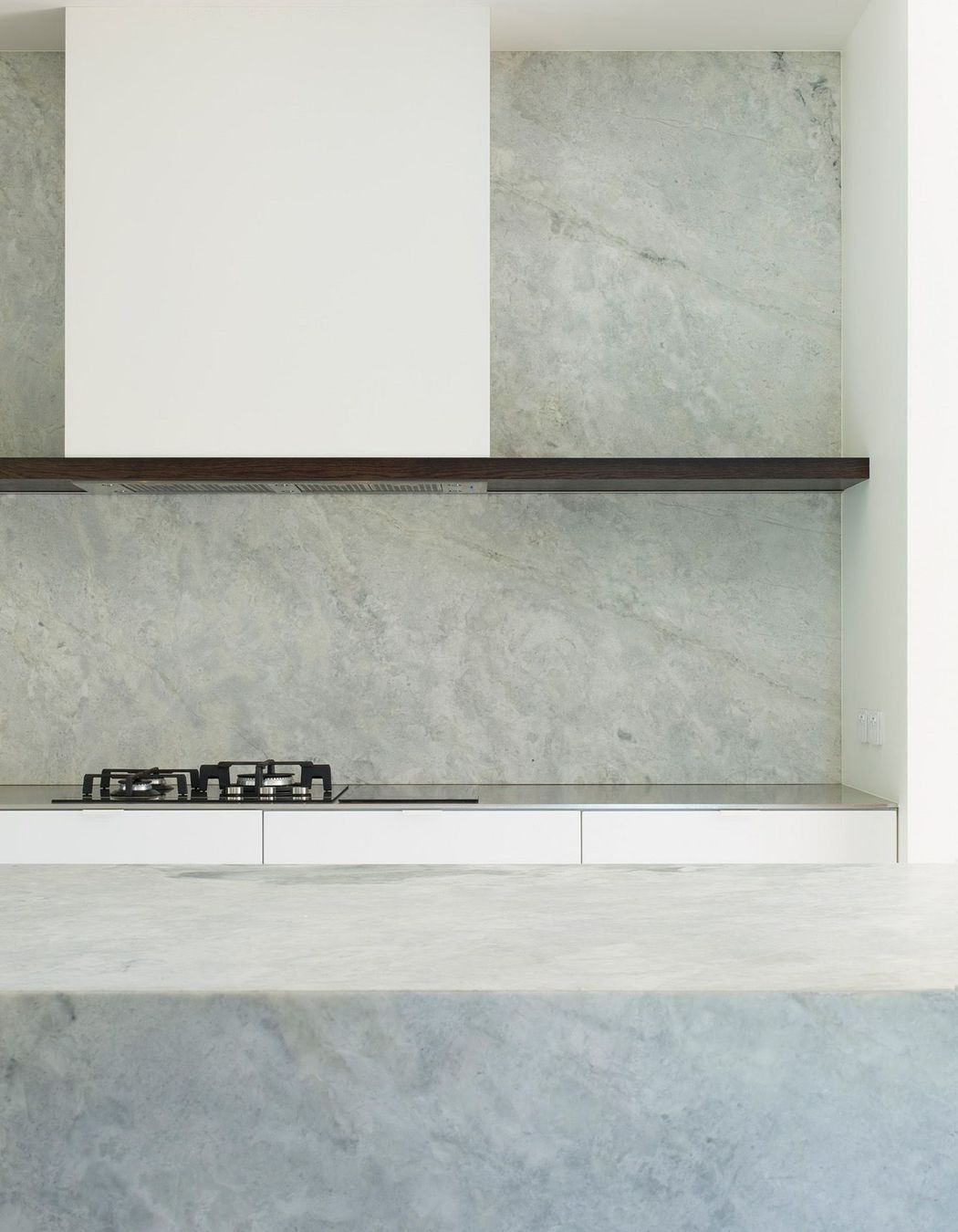 This low-maintenance kitchen is crisp and clean like the exterior of Ryan House.