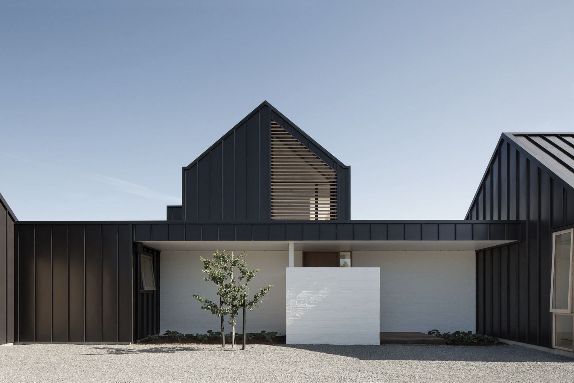 The main entry leads into the main living area module, with the master bedroom and ensuite bathroom on the upper level.