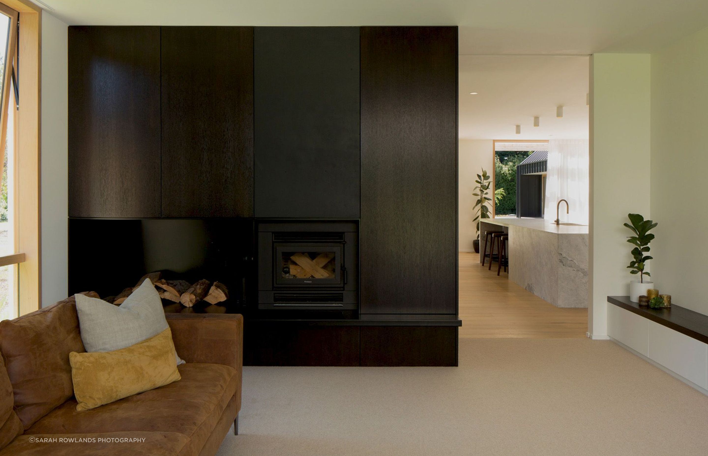 One of the lounge areas has a fireplace built into the back of the dining room cabinetry.