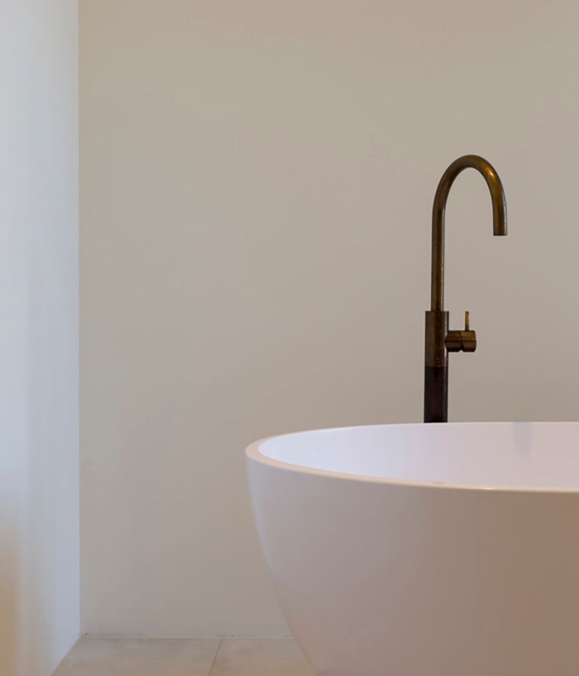 The 'Egg' freestanding bath with brass tapware from Plumline.