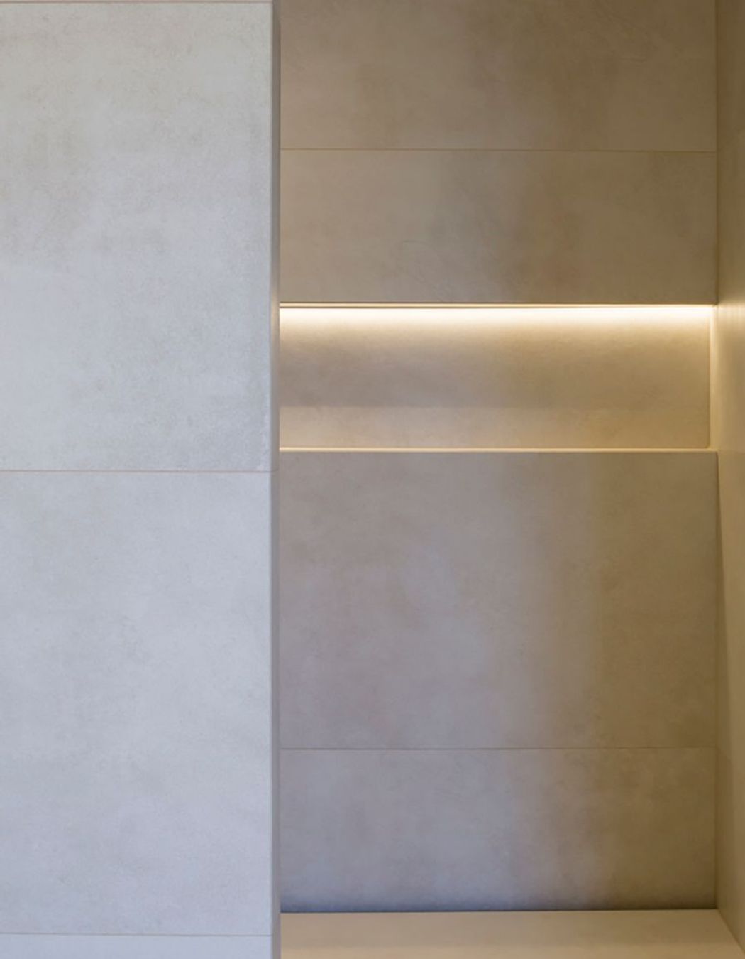 Subtle downlighting emphasises the patterns in the tiling.