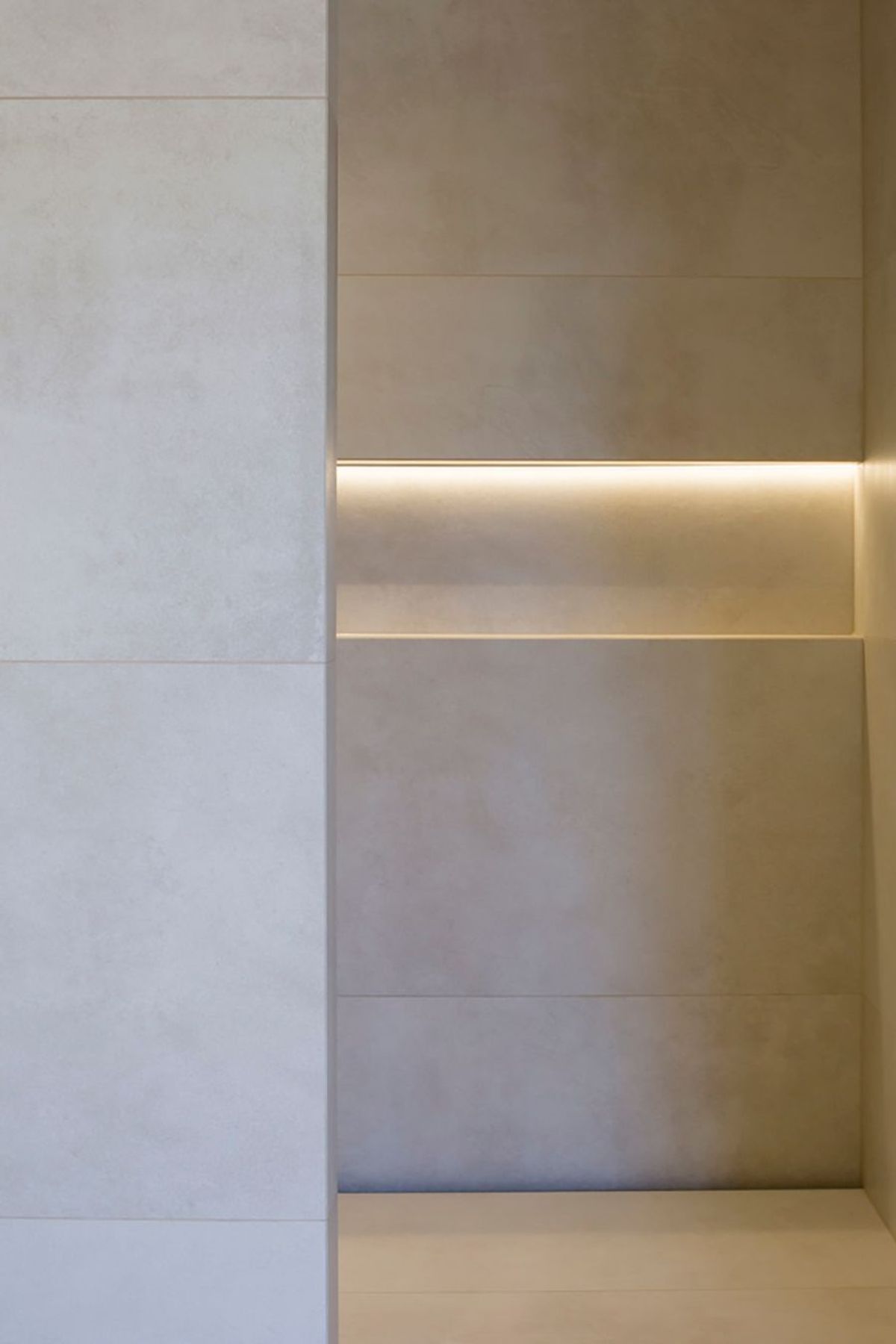 Subtle downlighting emphasises the patterns in the tiling.