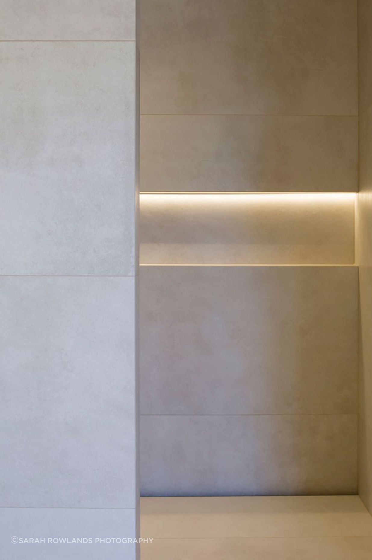 Subtle downlighting emphasises the patterns in the tiling.