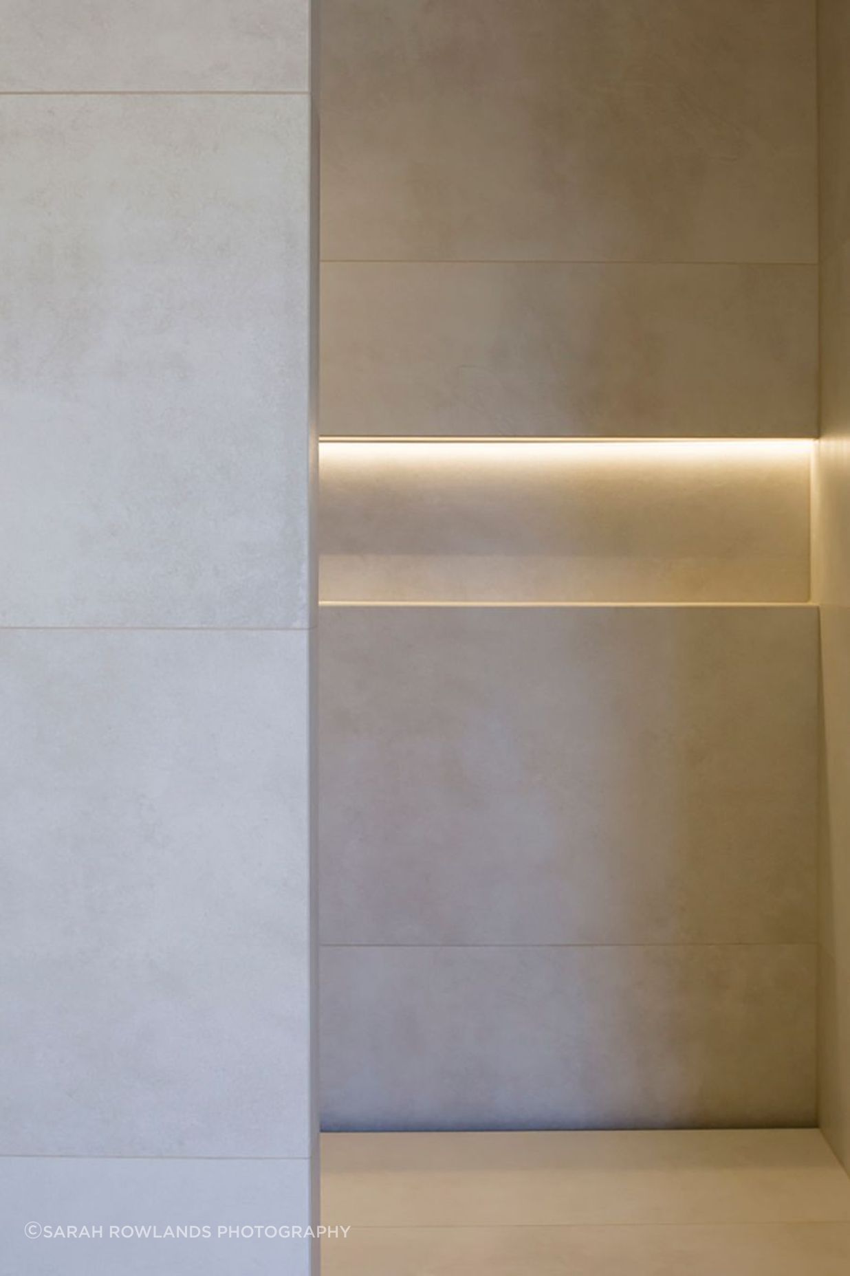 Subtle downlighting emphasises the patterns in the tiling.