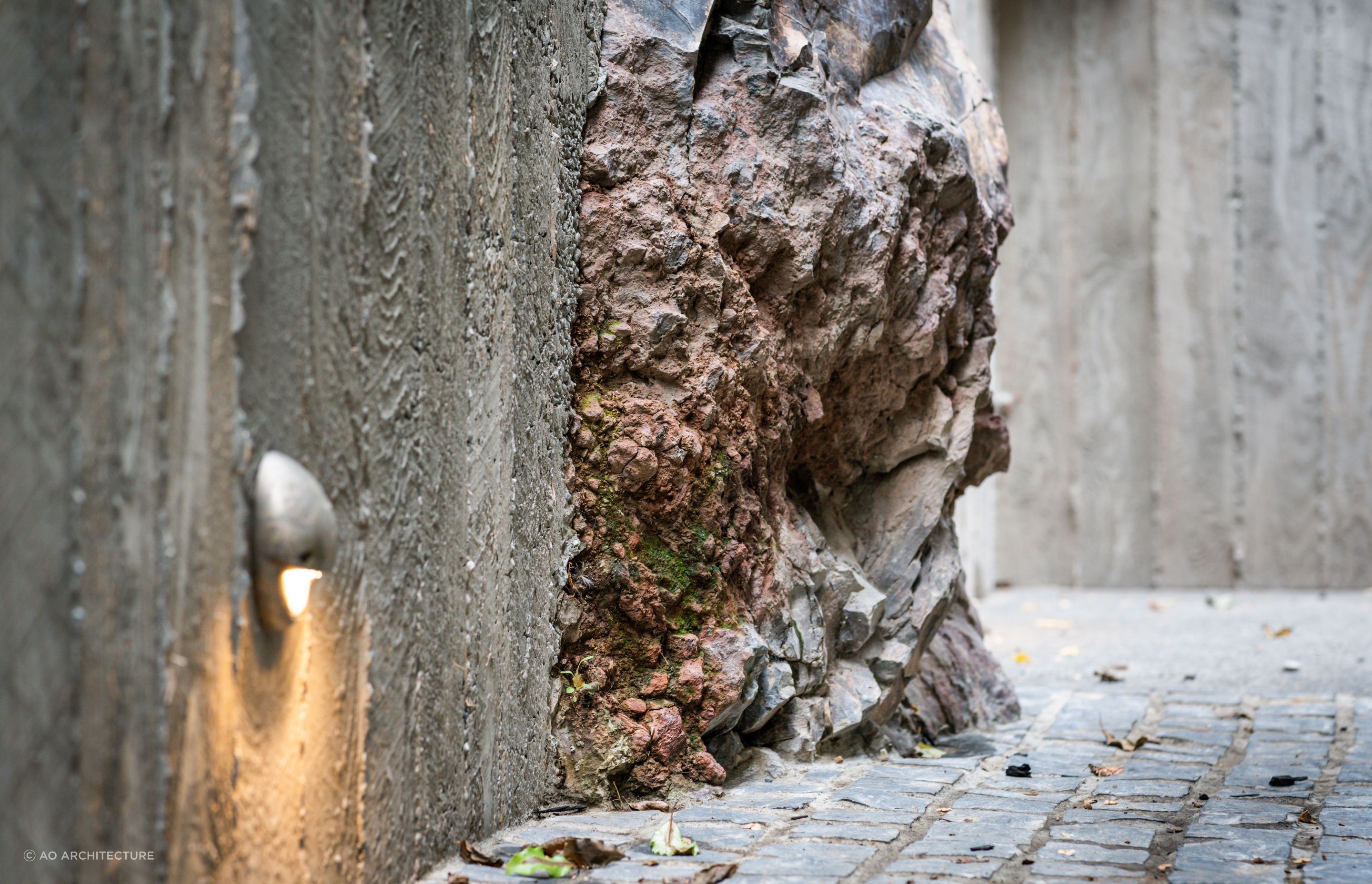 Natural textures and finishes offer a unique juxtaposition with the basalt cliff face. 