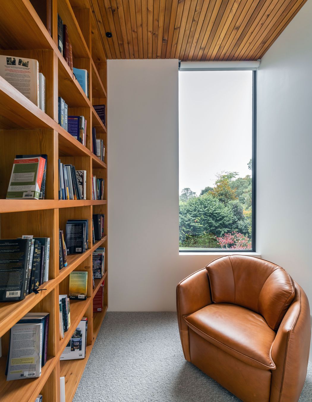 Full-height bookshelves were incorporated to house the owners' book collection.