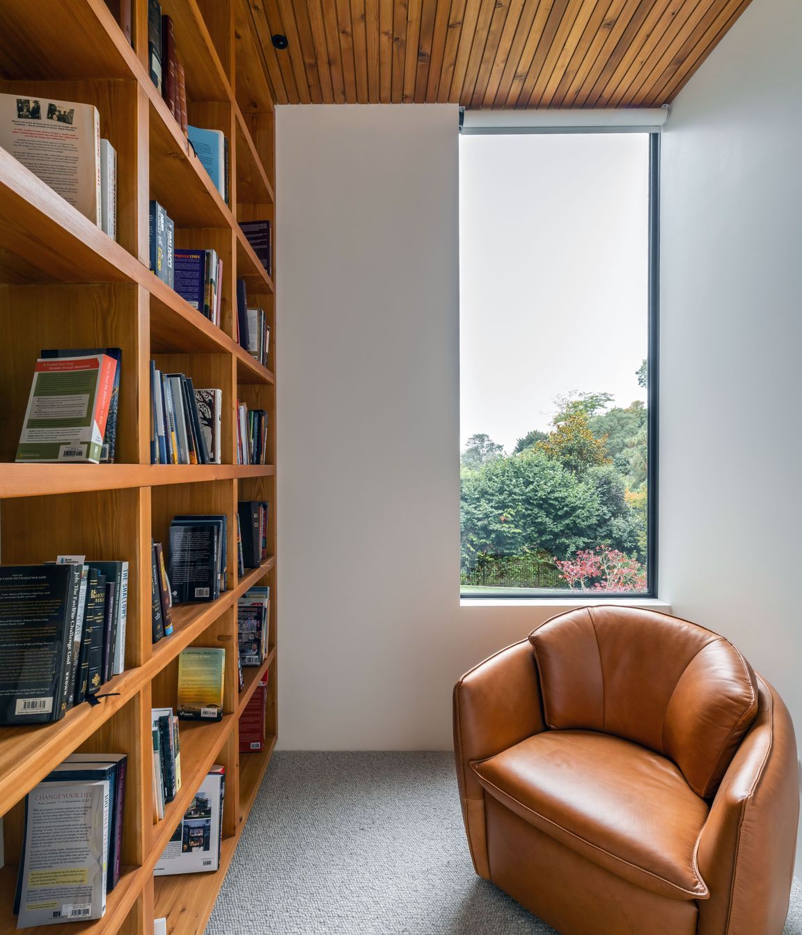 Full-height bookshelves were incorporated to house the owners' book collection. 