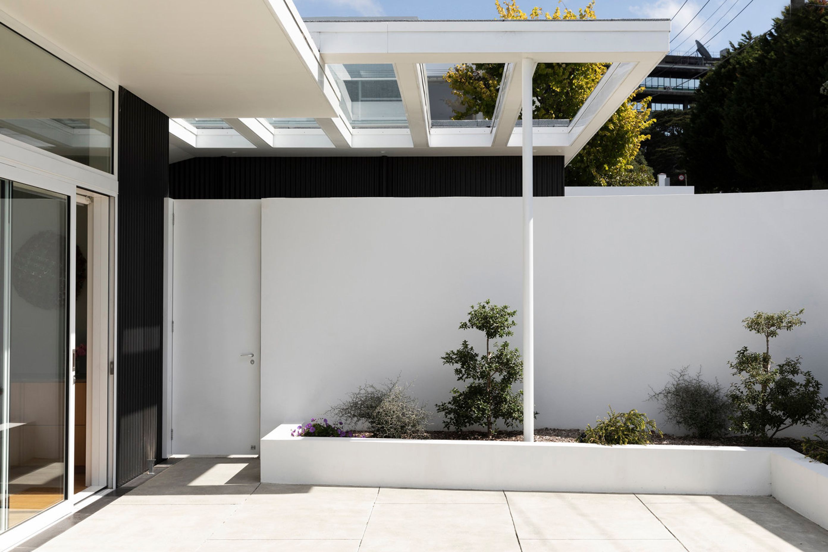 The courtyard of the upstairs apartment provides a sheltered north-facing spot to enjoy the outdoors.