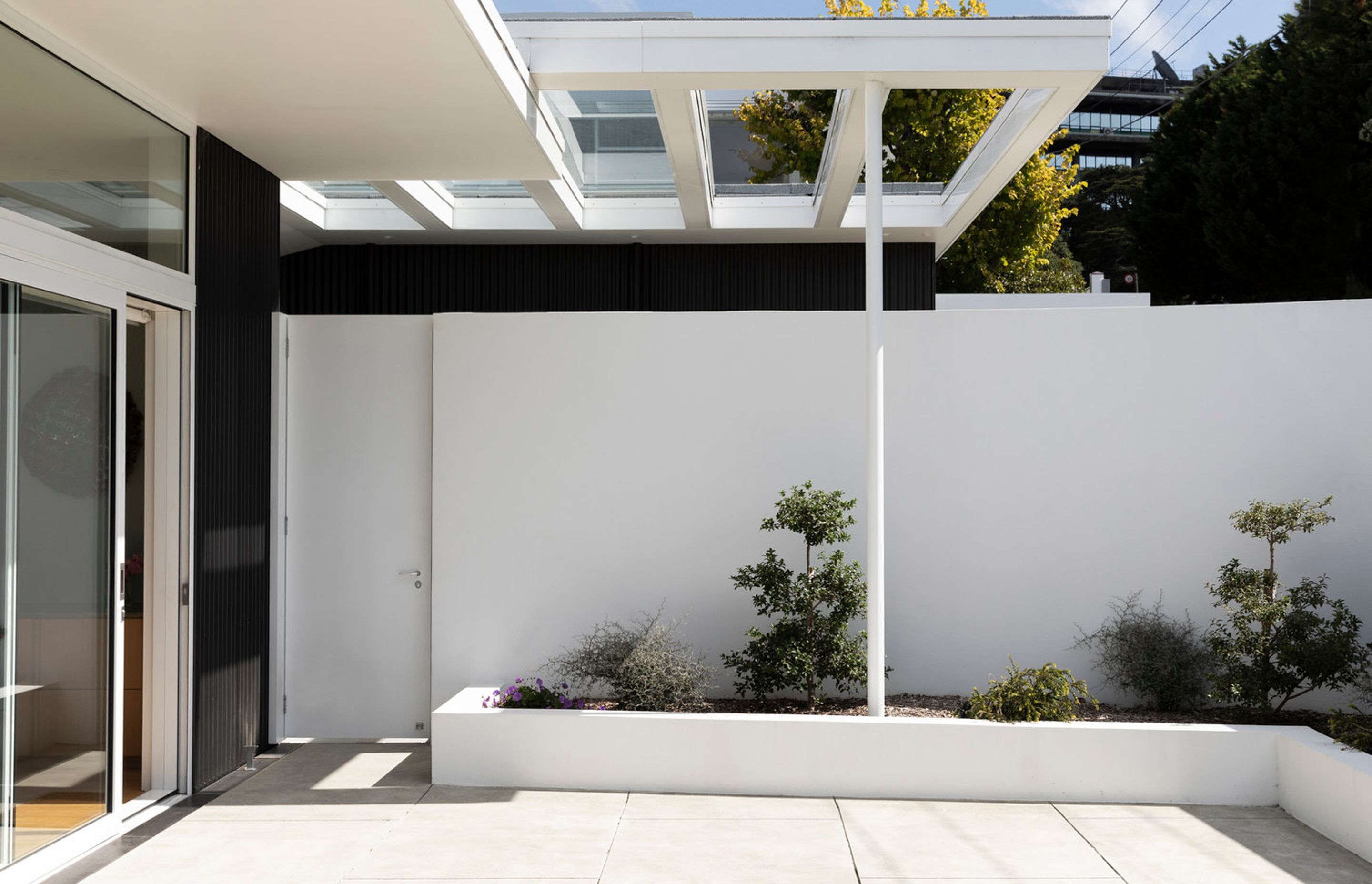 The courtyard of the upstairs apartment provides a sheltered north-facing spot to enjoy the outdoors.