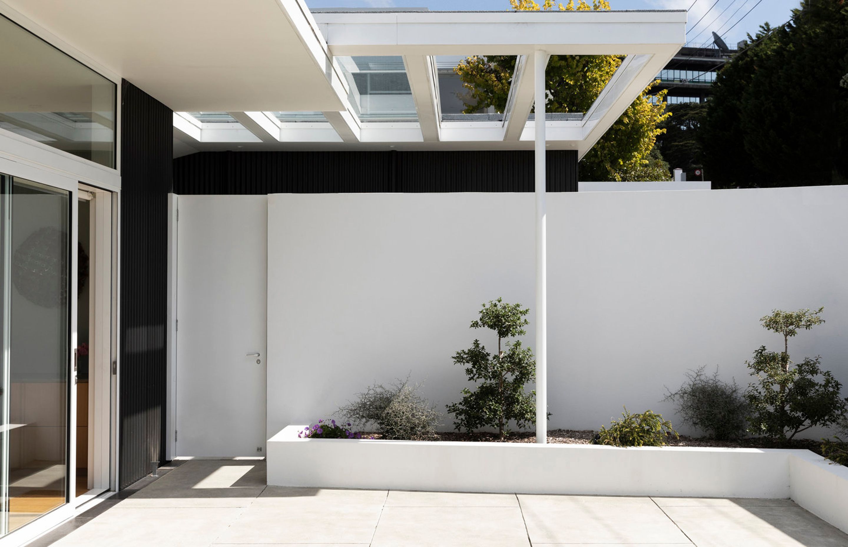 The courtyard of the upstairs apartment provides a sheltered north-facing spot to enjoy the outdoors.