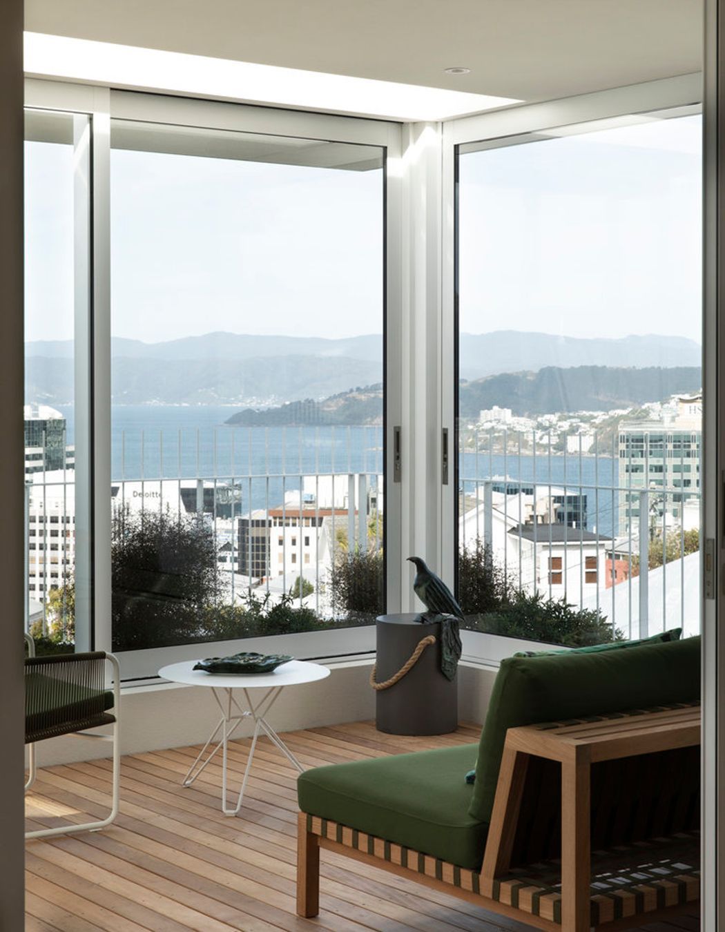 The winter garden has a Network 121 sofa and Harp string chair by Roda.