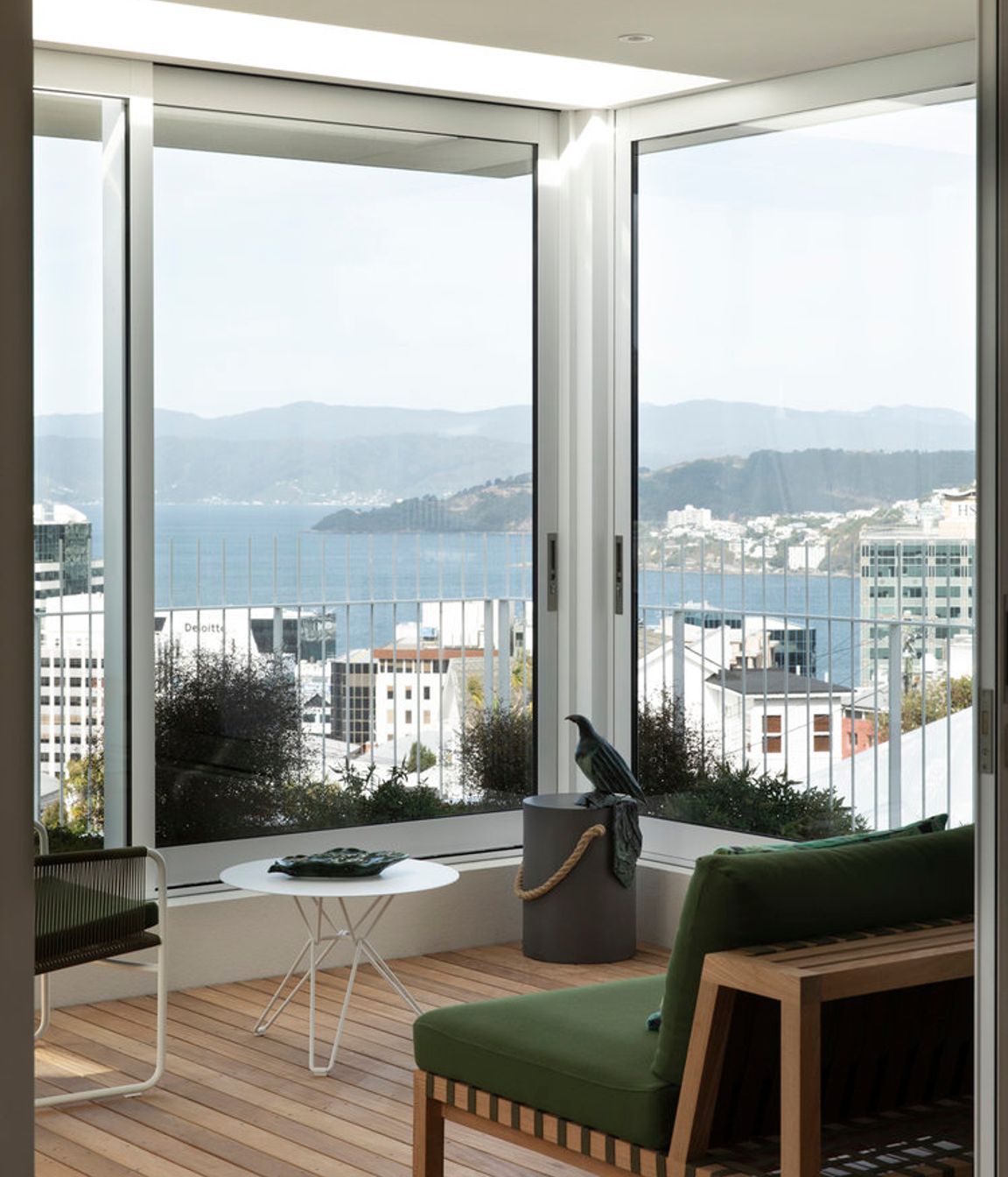 The winter garden has a Network 121 sofa and Harp string chair by Roda.