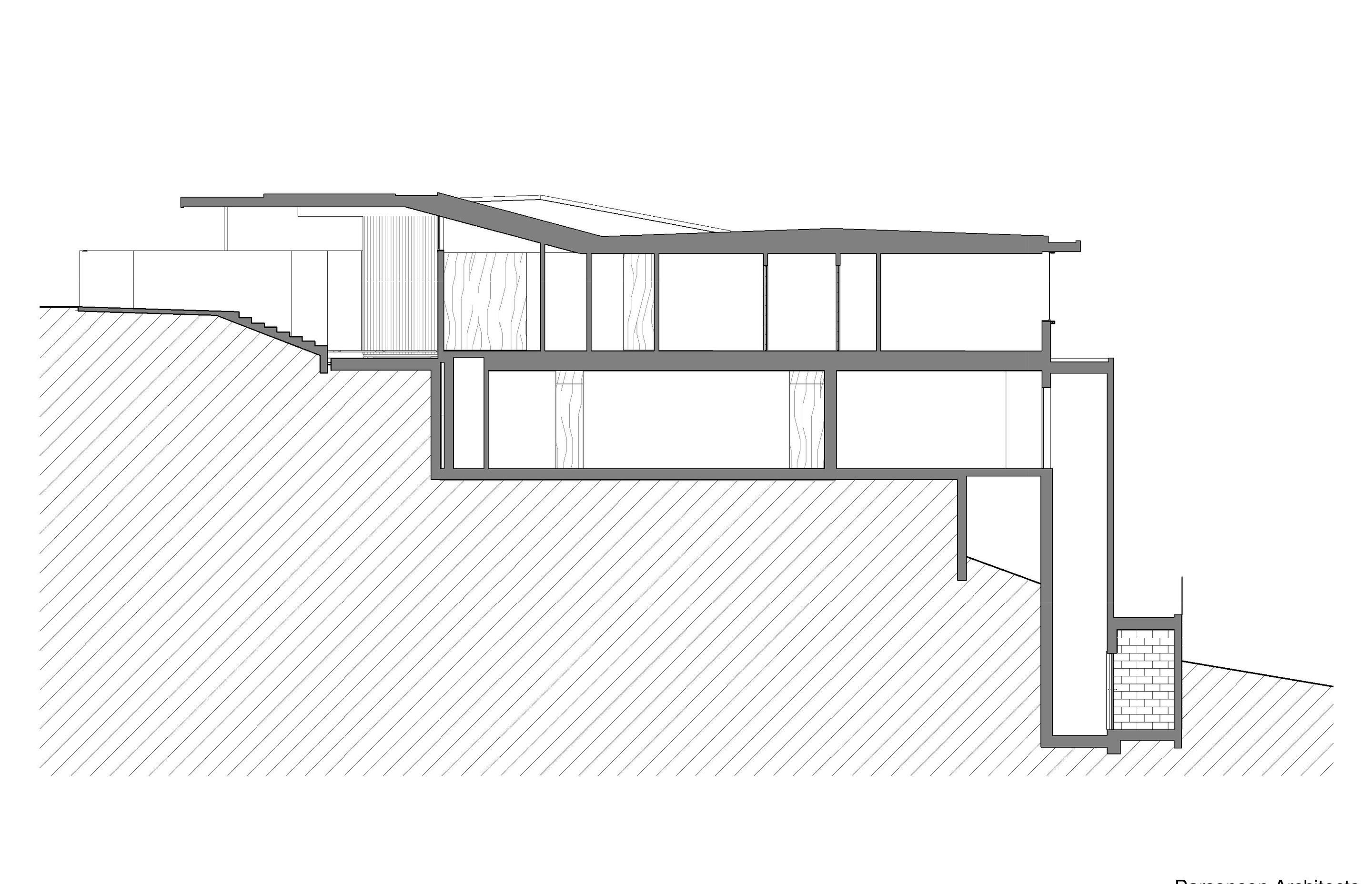 The section cuts through the house and shows the lift up from Salmont Place on the right and the gull-wing shaped roof.