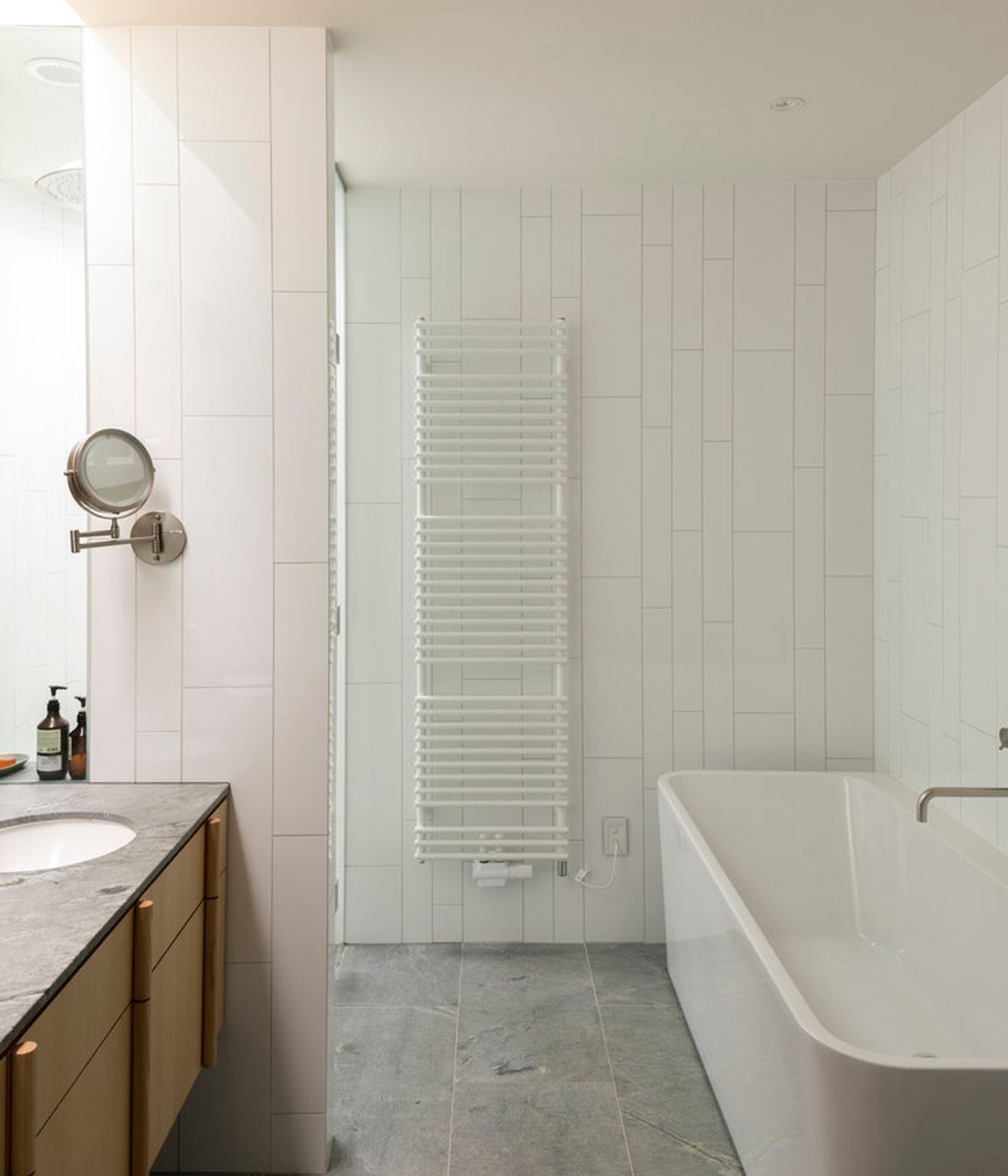 Tiling has been laid out in an irregular pattern, hinting at the verticality of the exterior.