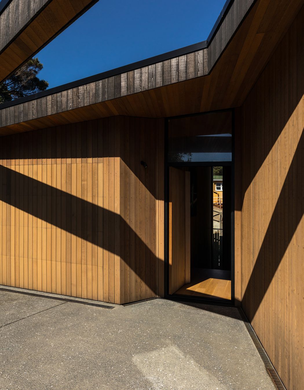 A series of cuts and incisions has exposed the weathered surface revealing the lighter, warmer tones beneath.