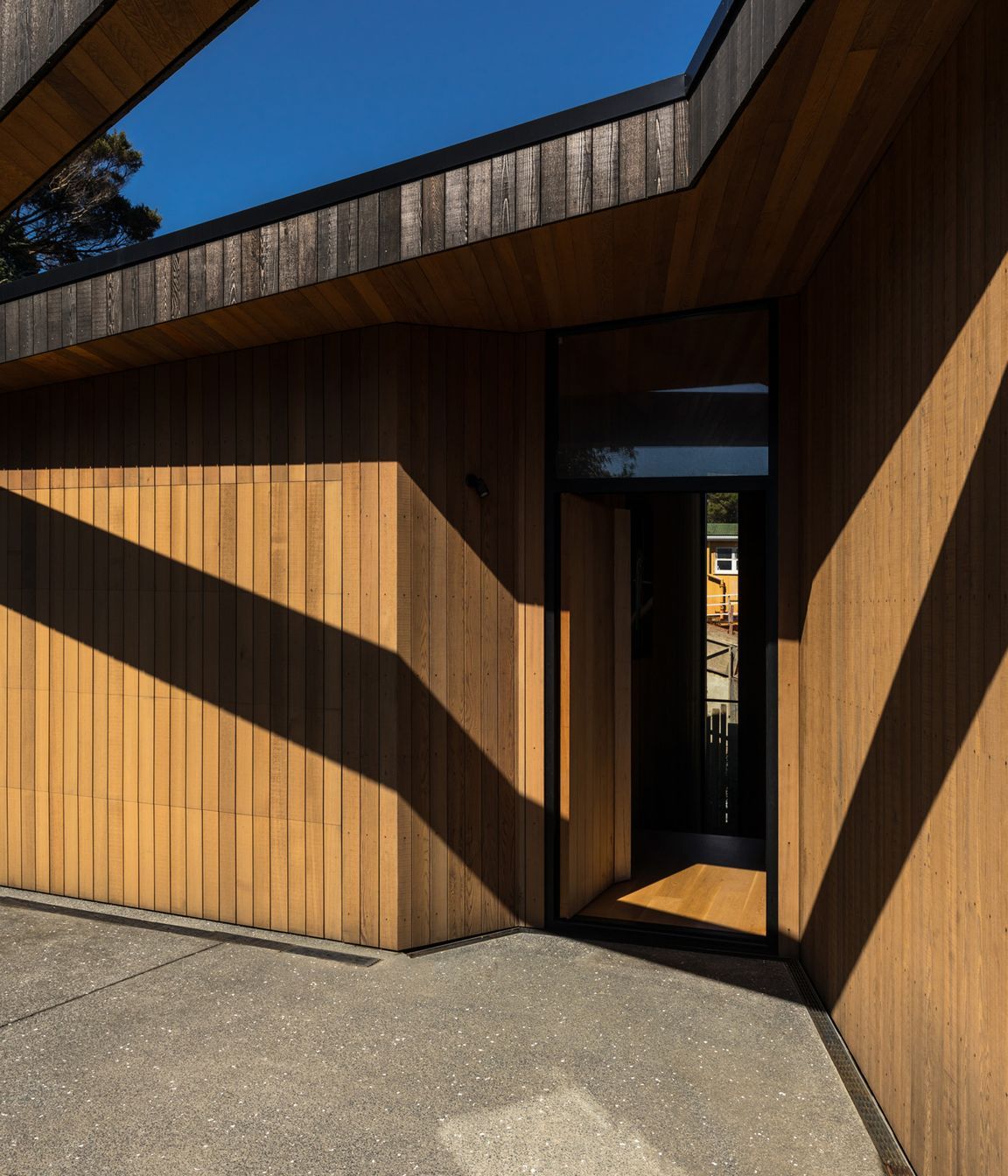 A series of cuts and incisions has exposed the weathered surface revealing the lighter, warmer tones beneath.
