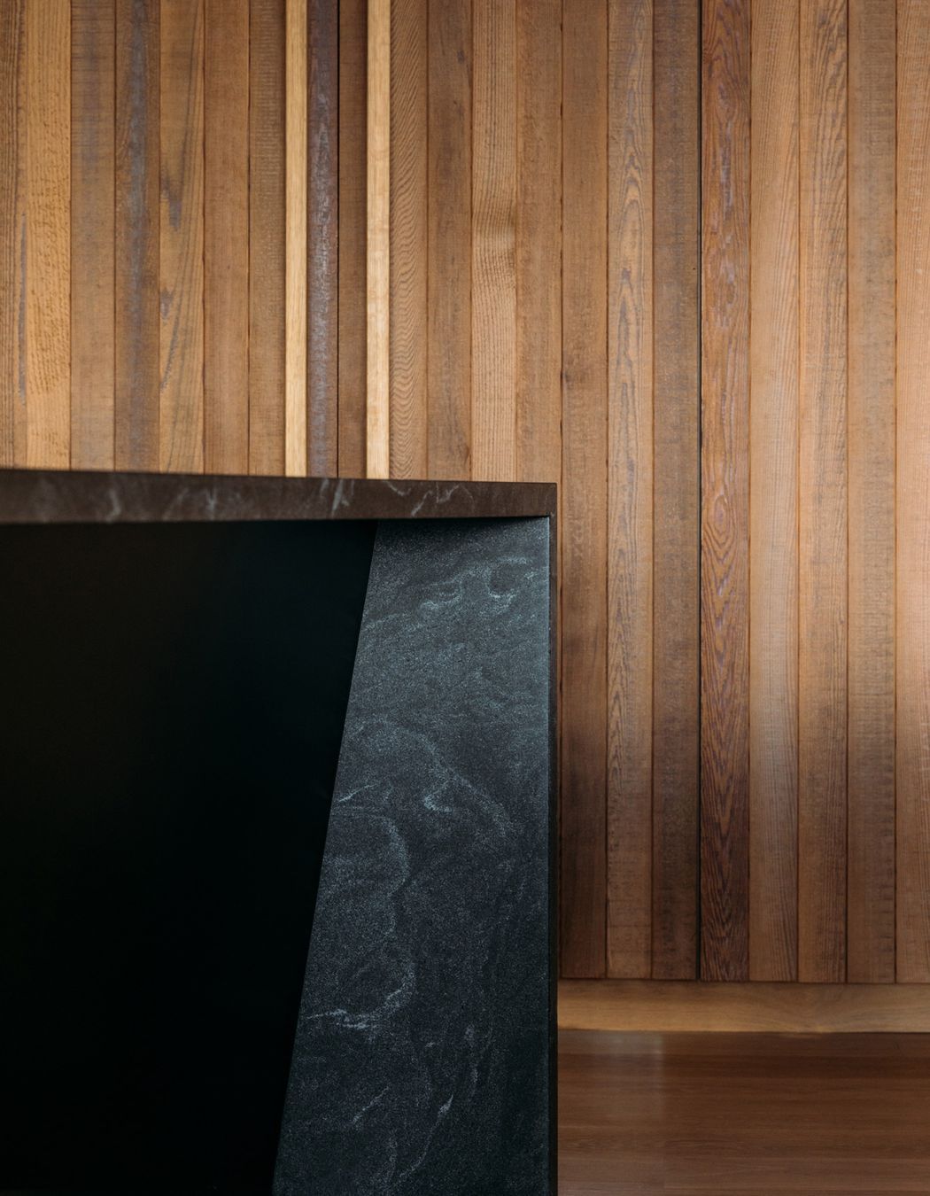 The material palette of cedar and oak was augmented with black granite in the kitchen.