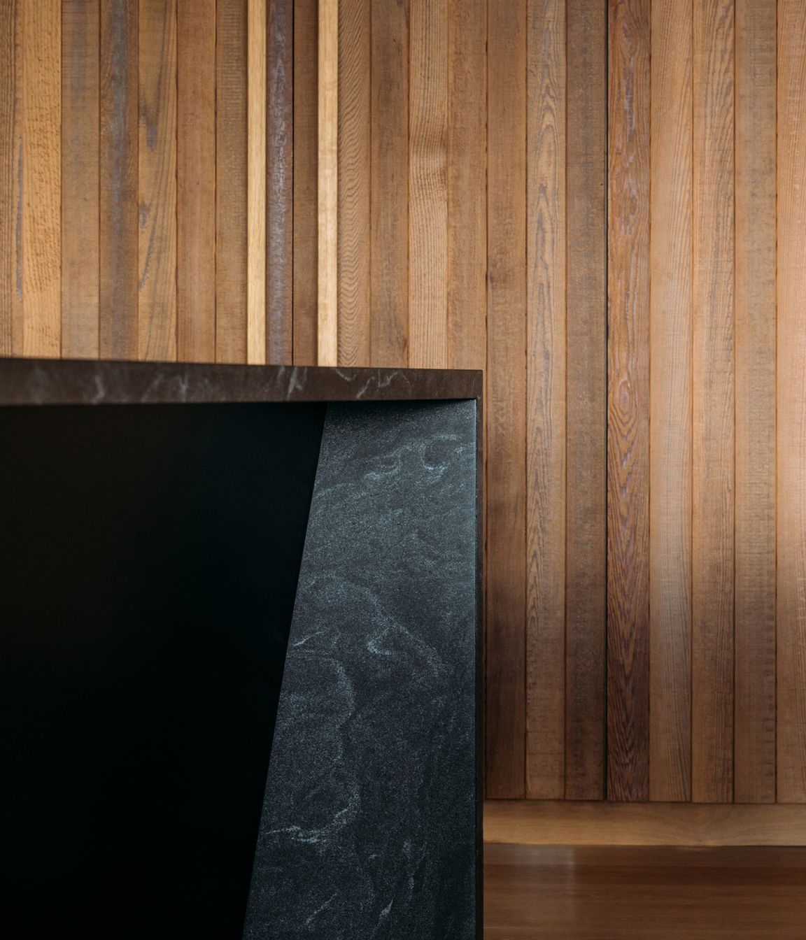 The material palette of cedar and oak was augmented with black granite in the kitchen.