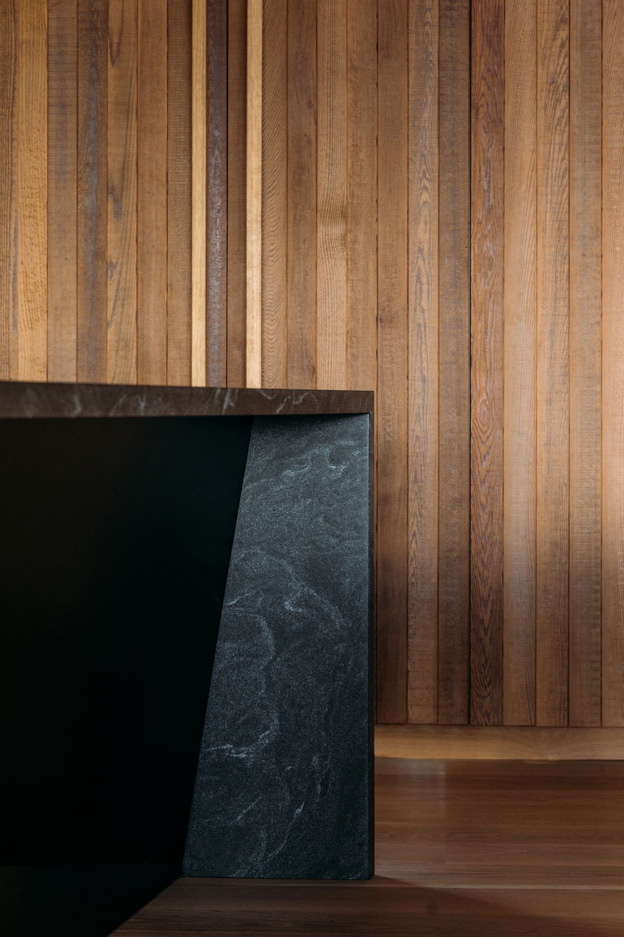 The material palette of cedar and oak was augmented with black granite in the kitchen.