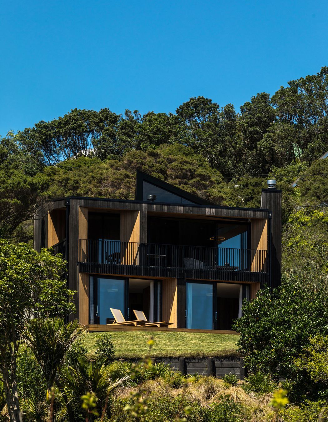 The house sits at the top of a subdivided site with neighbours on all sides yet still retains a sense of priva