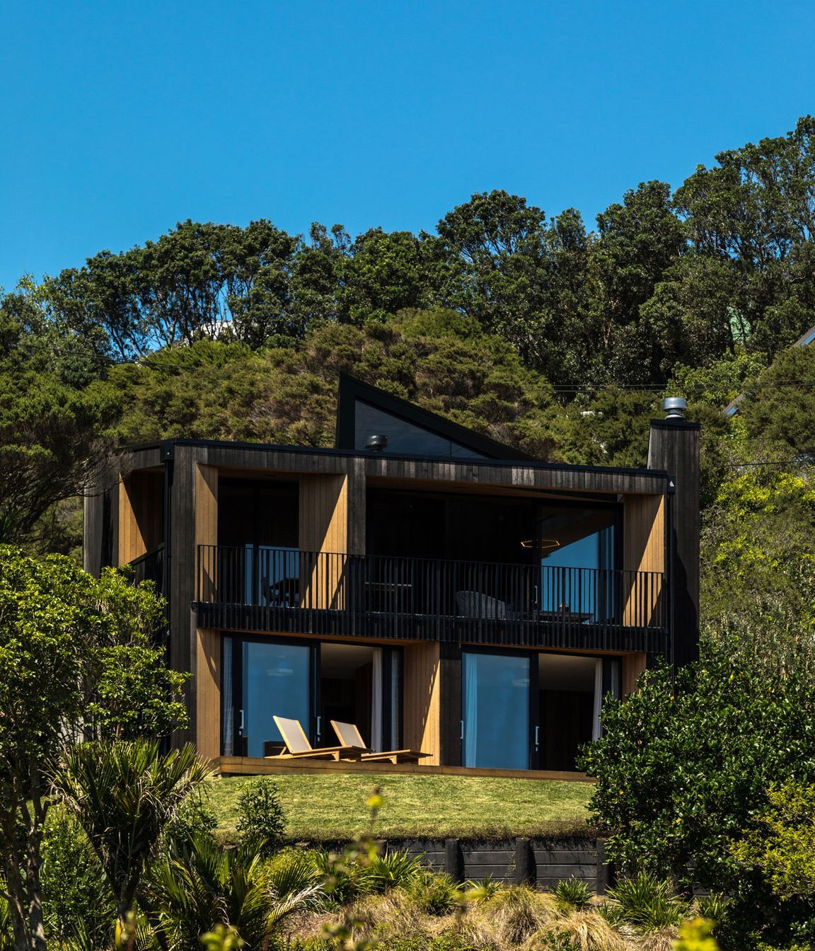 The house sits at the top of a subdivided site with neighbours on all sides yet still retains a sense of priva
