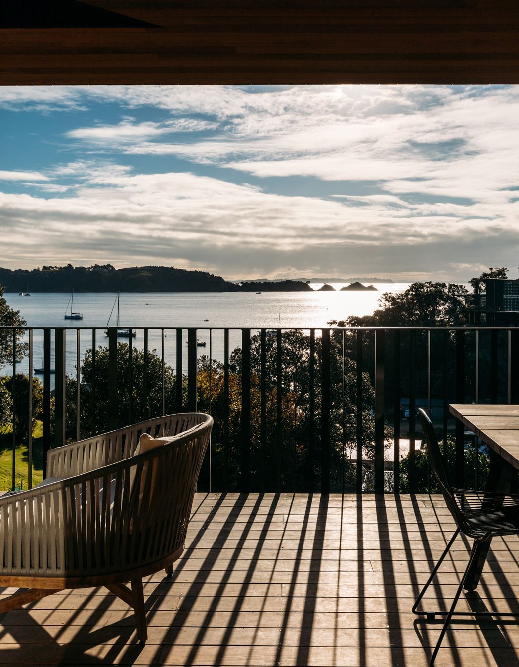 The north-west facing deck is bathed in afternoon light, the perfect vantage point for taking in the view.
