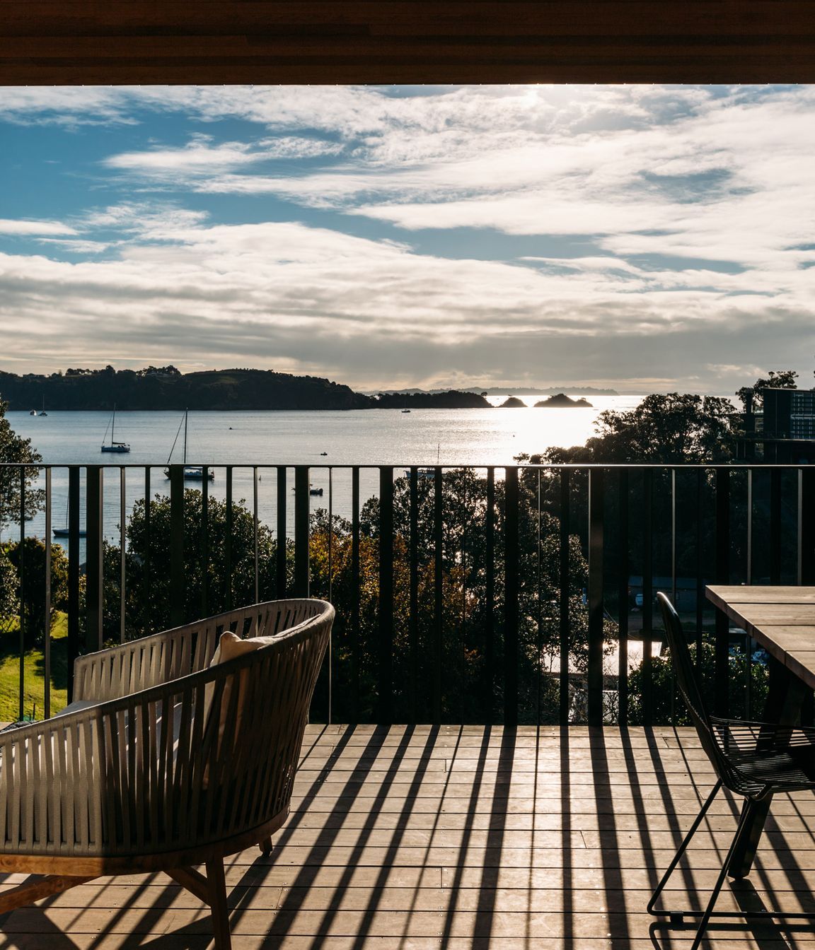 The north-west facing deck is bathed in afternoon light, the perfect vantage point for taking in the view.