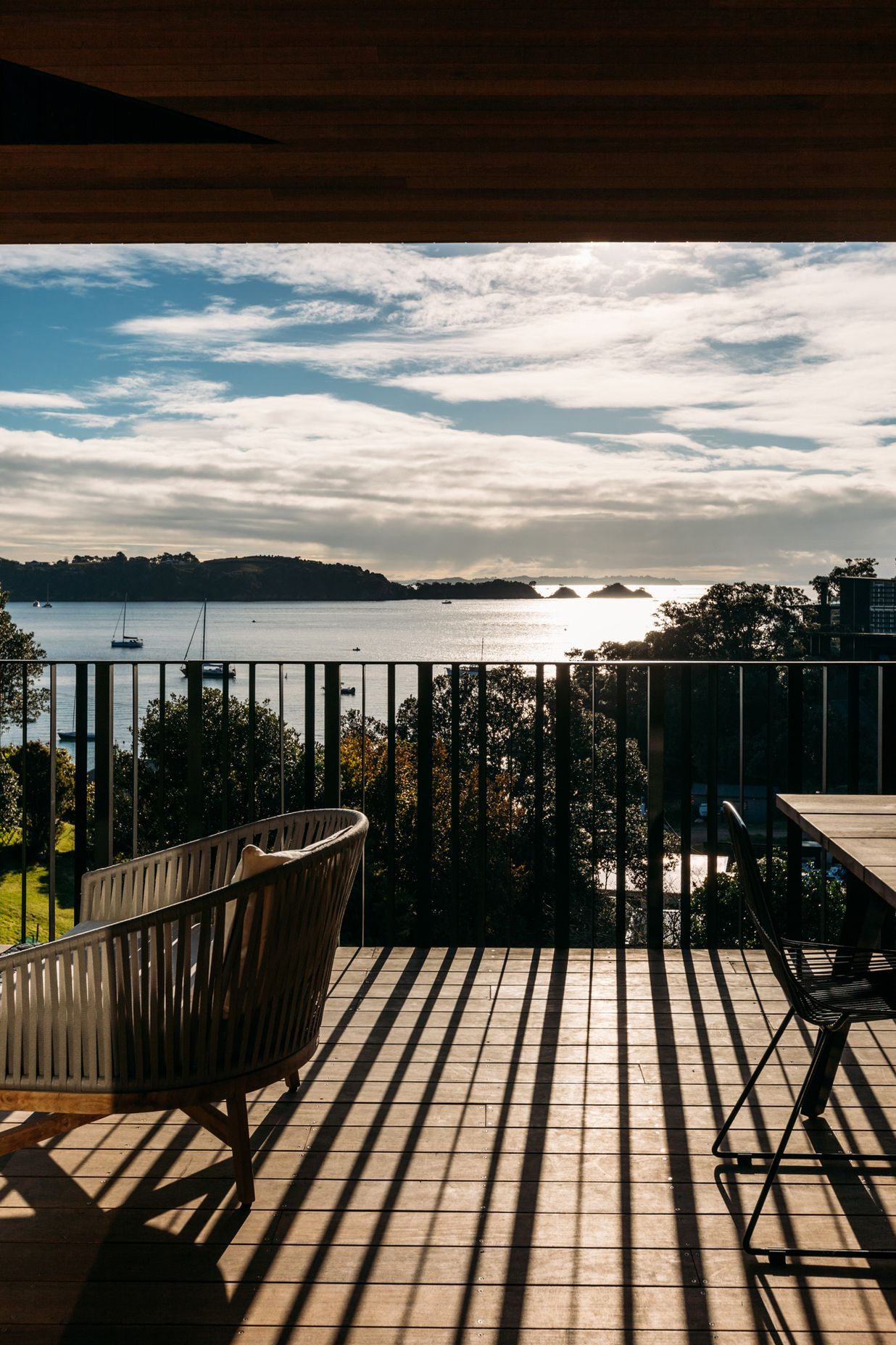 The north-west facing deck is bathed in afternoon light, the perfect vantage point for taking in the view.