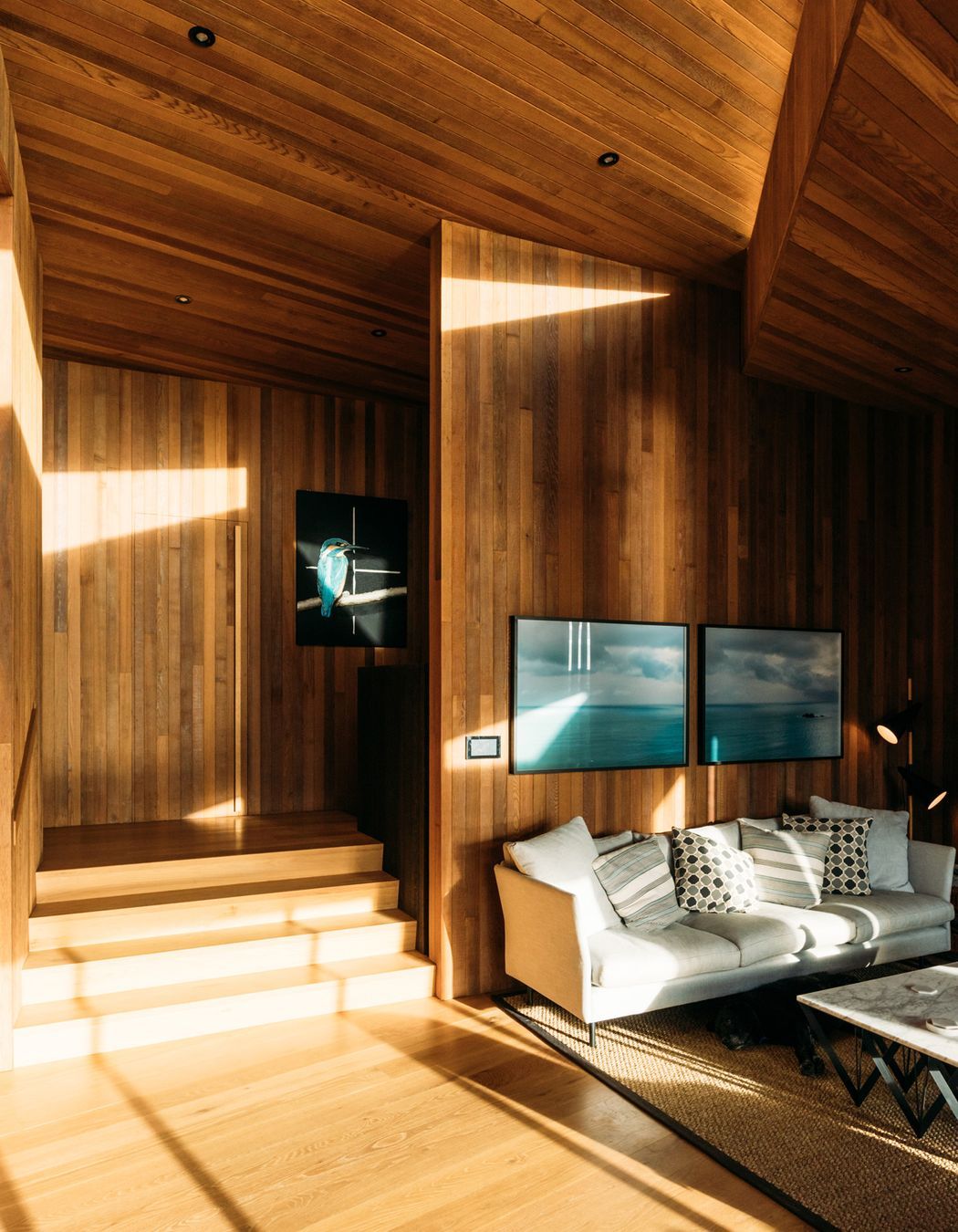 A large, triangular skylight above the living area, helps draw light into the interior throughout the day.