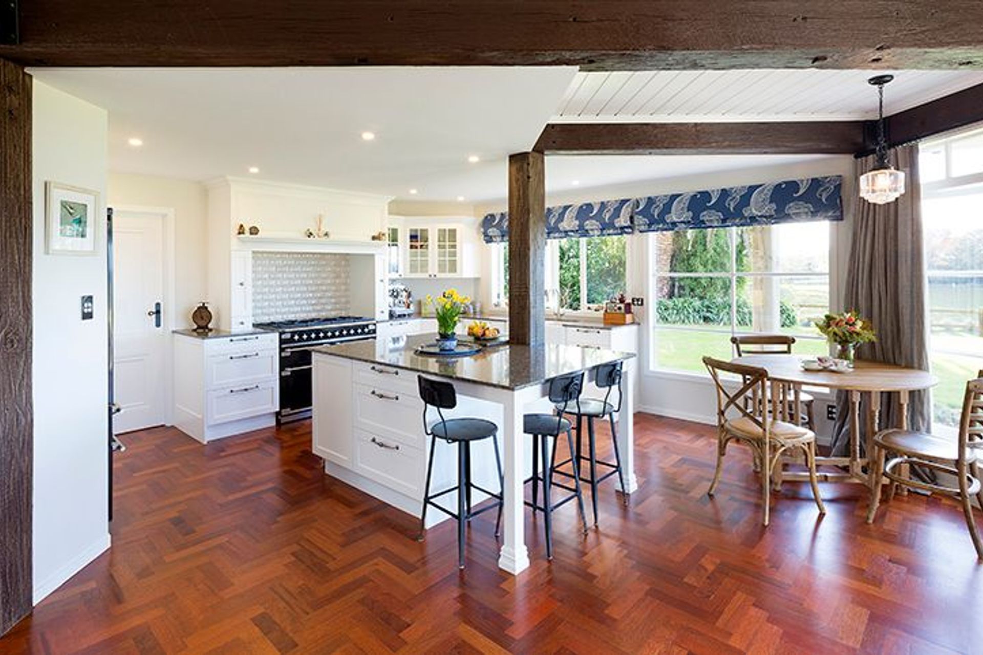 Original Jarrah parquet flooring resurfaced, French country style kitchen designed to work around the existing bridge beam post 