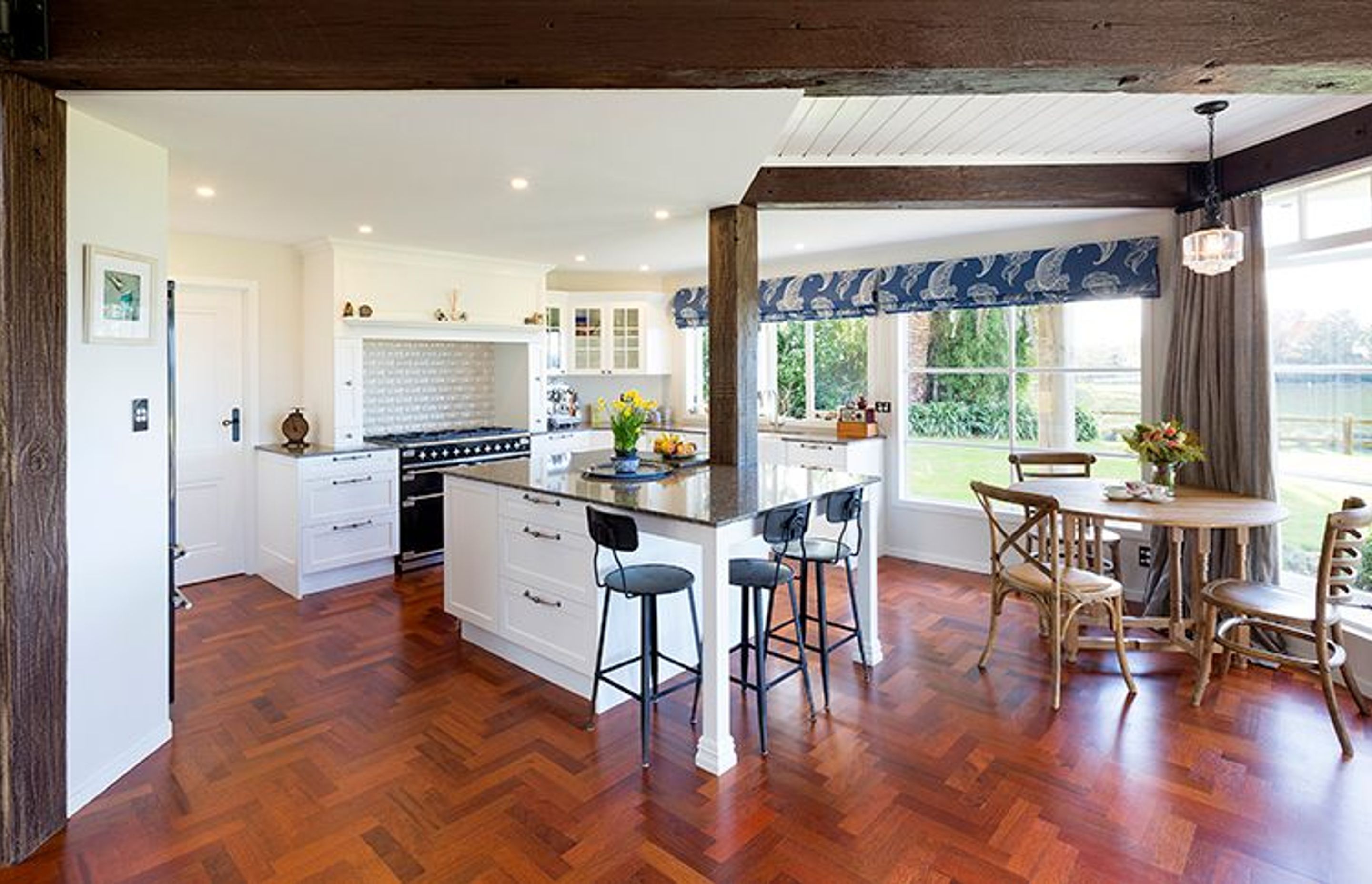 Original Jarrah parquet flooring resurfaced, French country style kitchen designed to work around the existing bridge beam post 