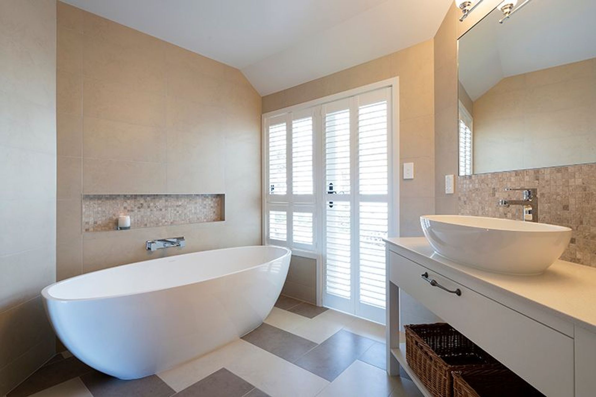 Family bathroom with custom vanity, shutters lead to outdoor spa courtyard