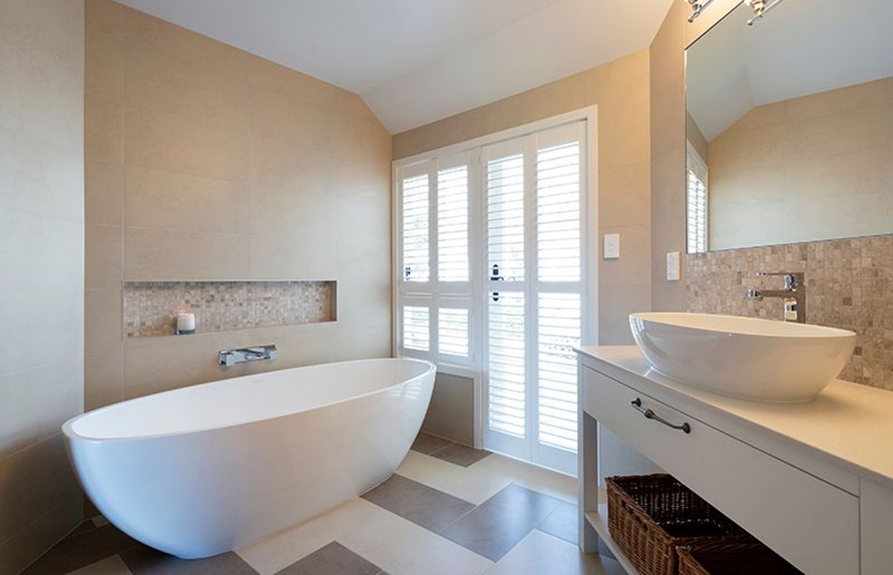 Family bathroom with custom vanity, shutters lead to outdoor spa courtyard