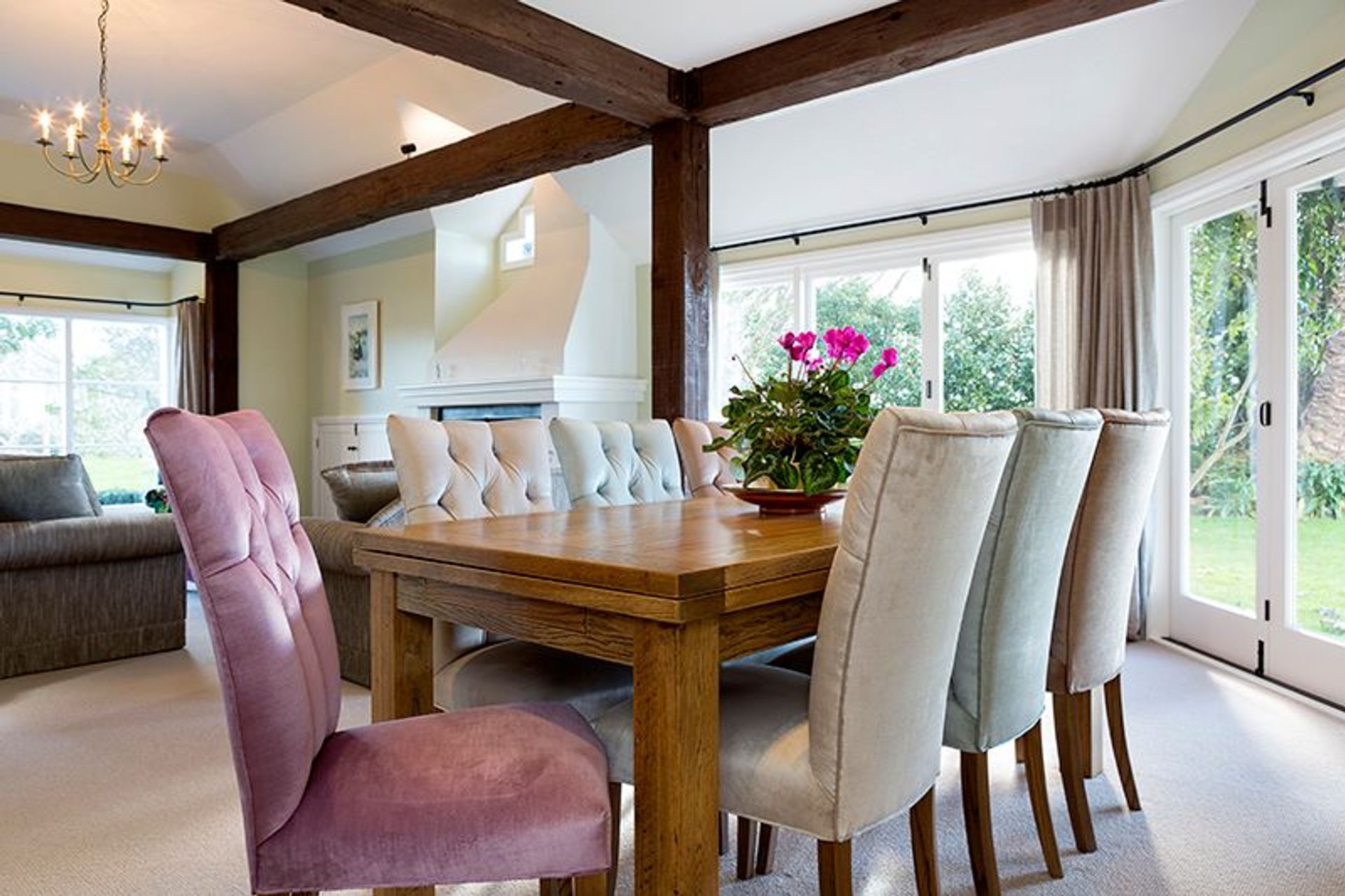 Modern Chair Co. dining chairs added to existing table, 4 sorbet shades of velvet with contrasting deep button detail