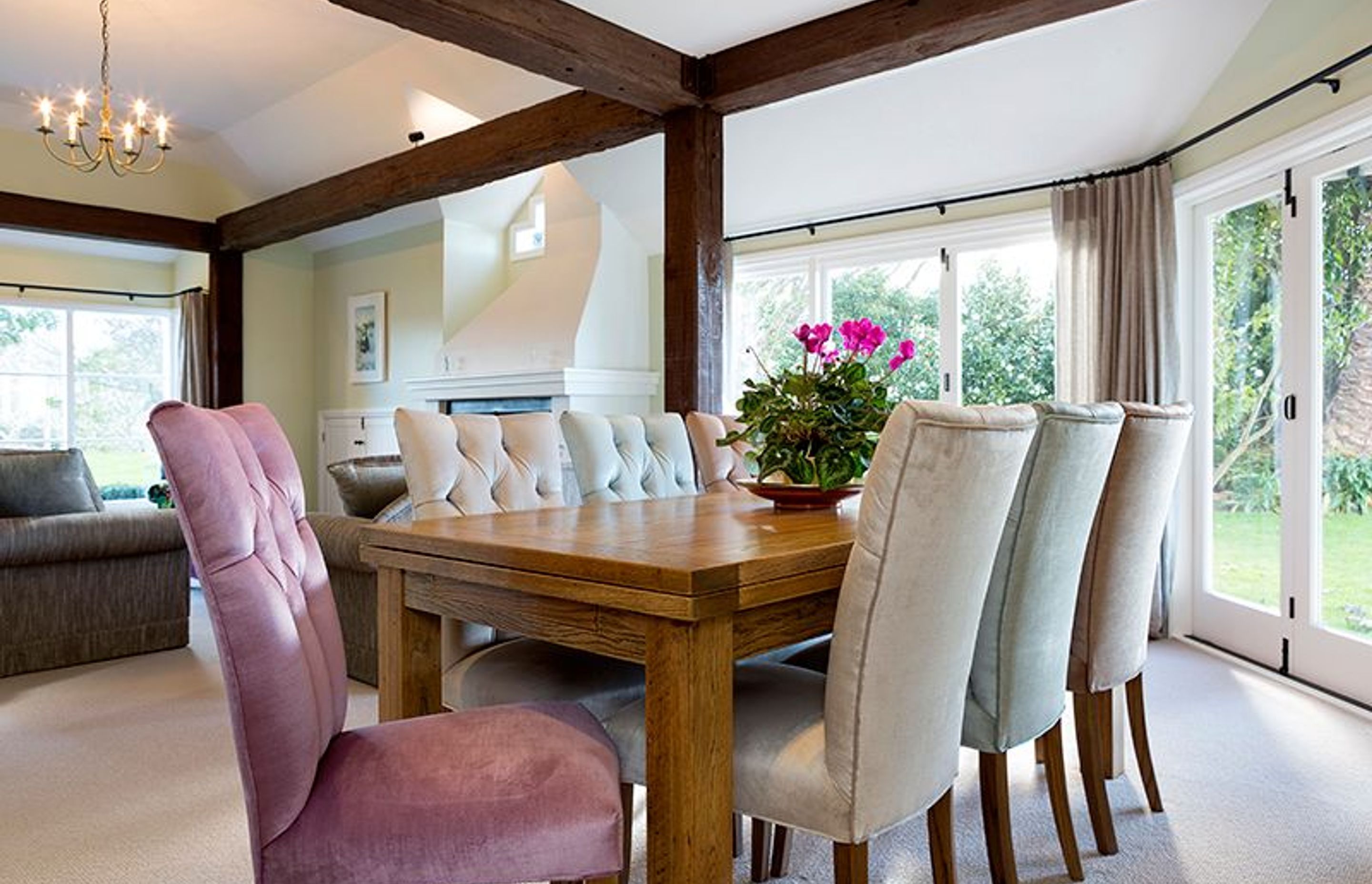 Modern Chair Co. dining chairs added to existing table, 4 sorbet shades of velvet with contrasting deep button detail