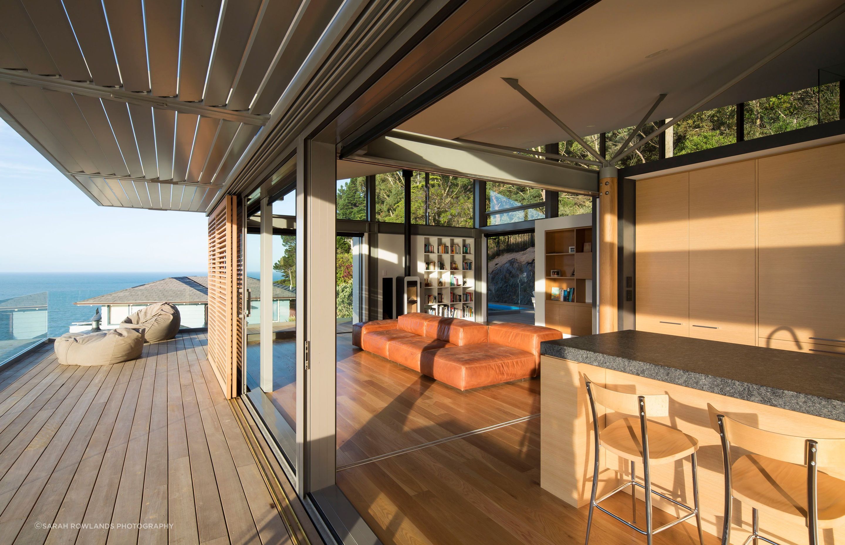 Sliding shutters and automated louvres help mitigate solar gain from the afternoon sun.