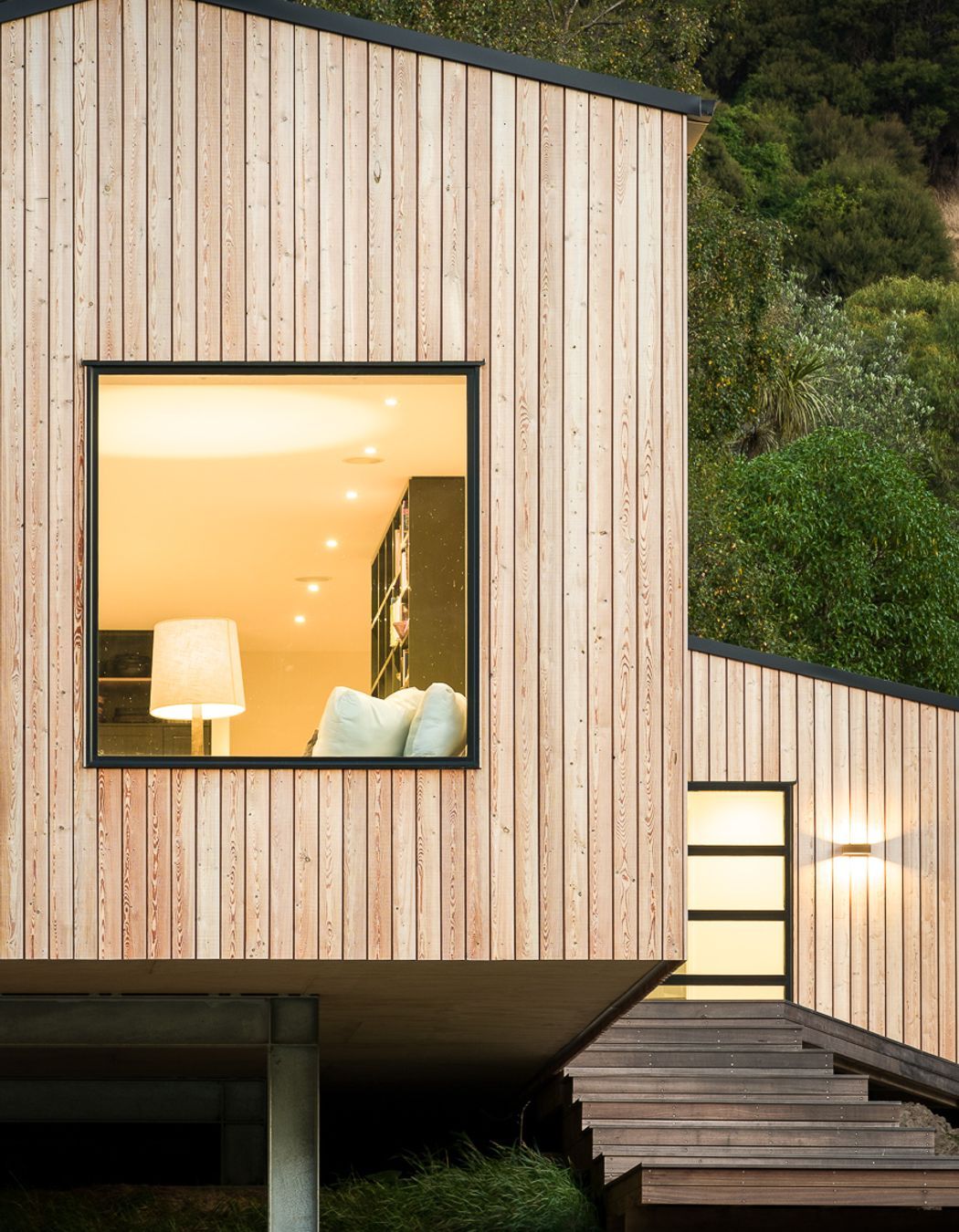 The entry stairs lead to an addition containing the entrance, bathroom and laundry.
