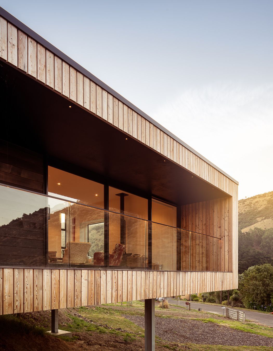 A glass balustrade maximises the view and accentuates the recessive cedar balcony.